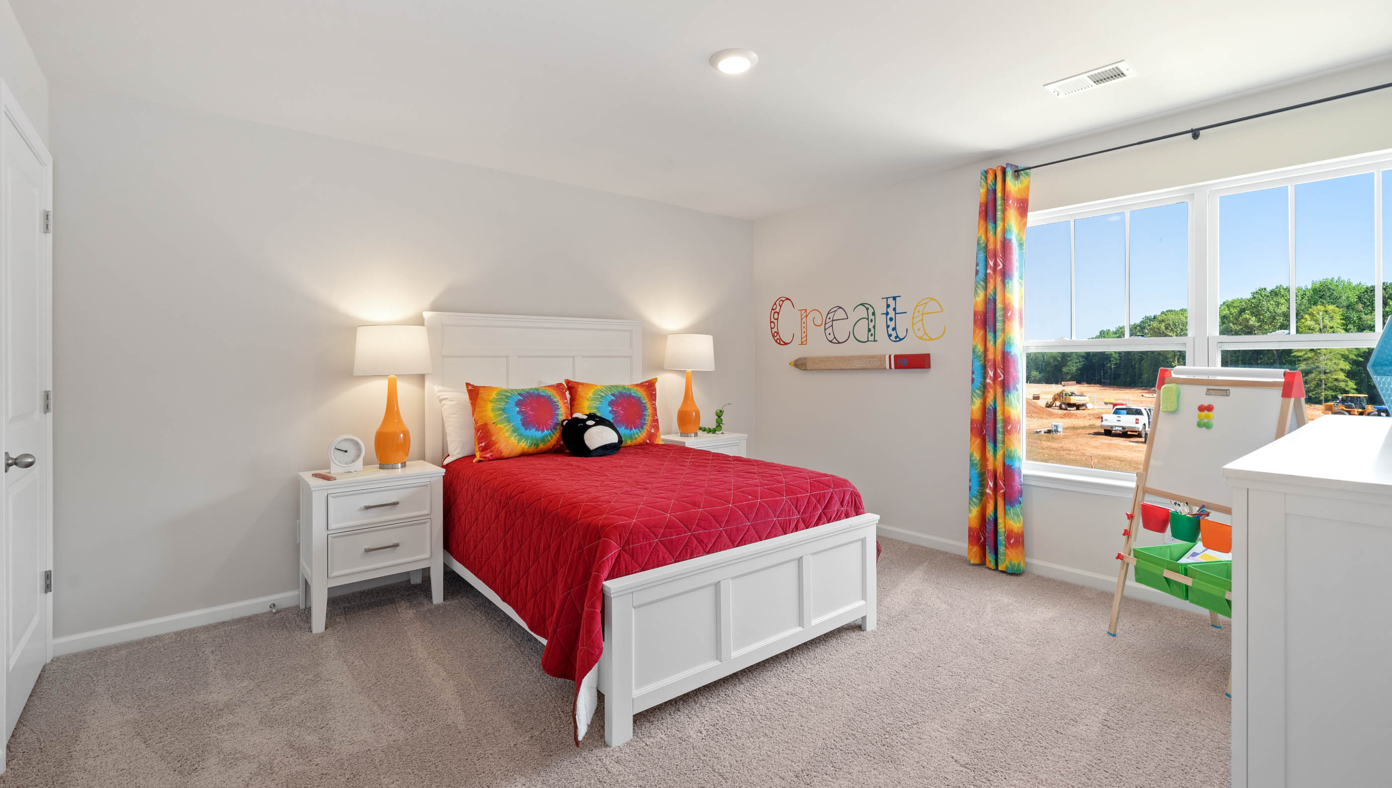 Bedroom with carpet and windows.