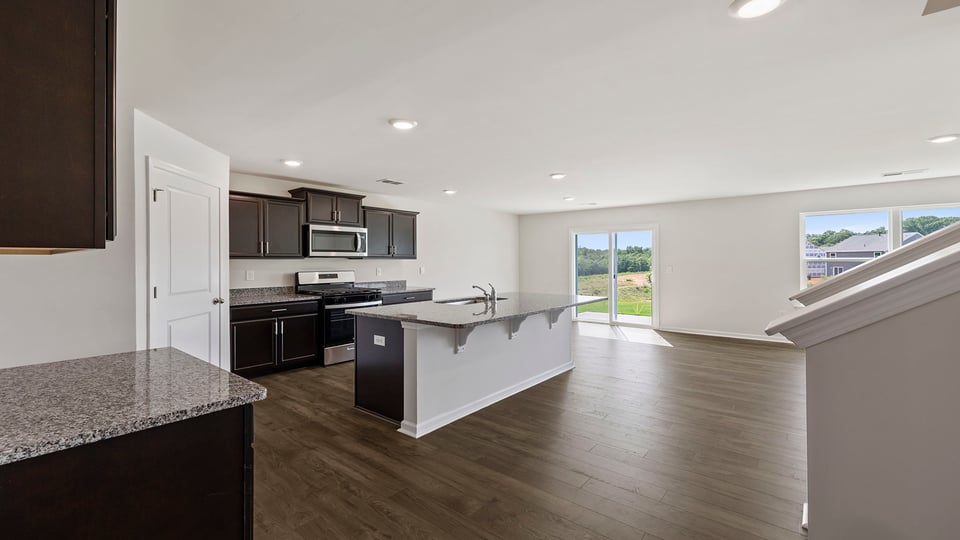 Kitchen and island with granite countertops.