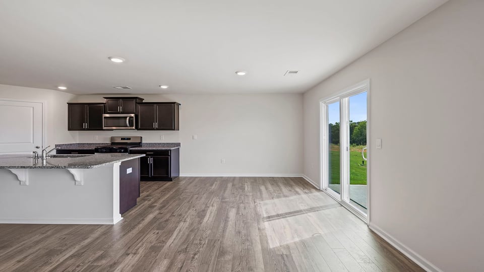 Kitchen and island with granite countertops.
