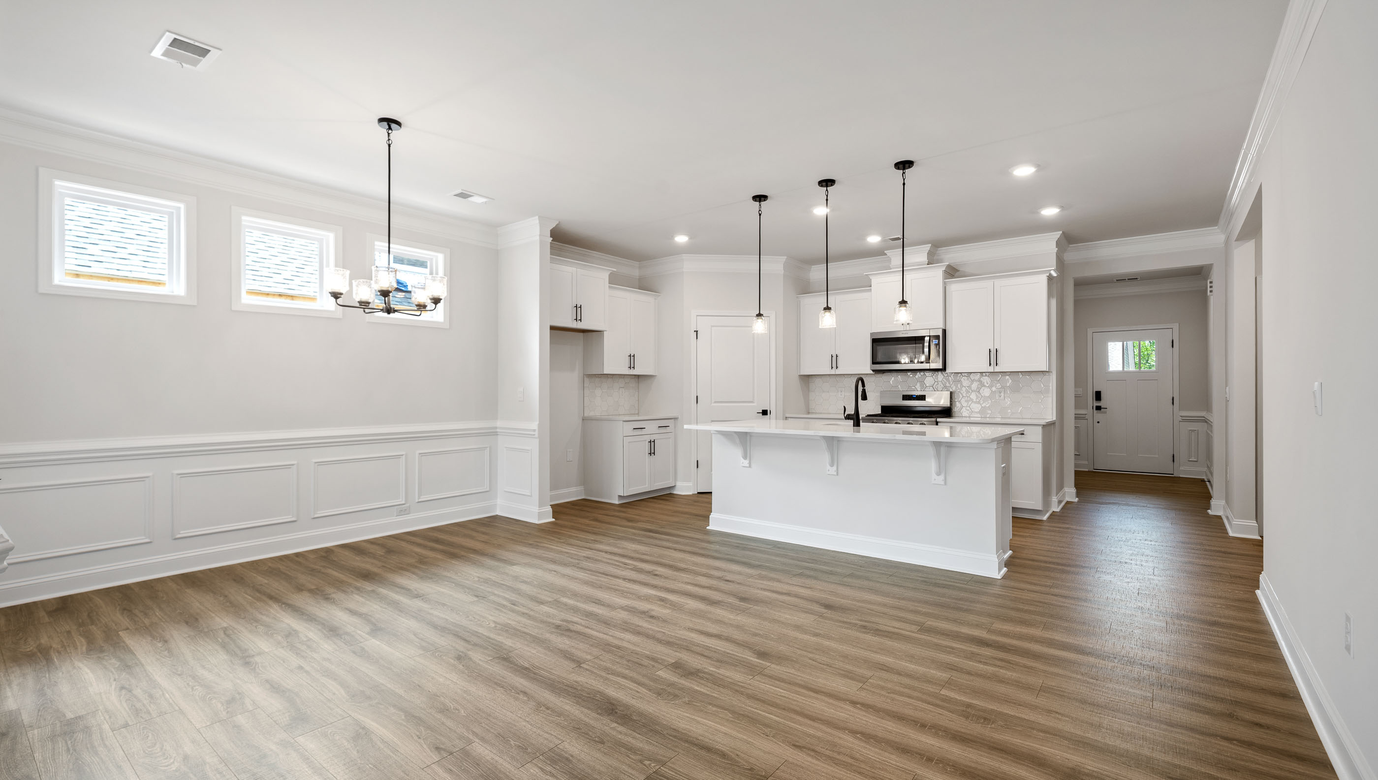 Family room with windows looking towards kitchen.