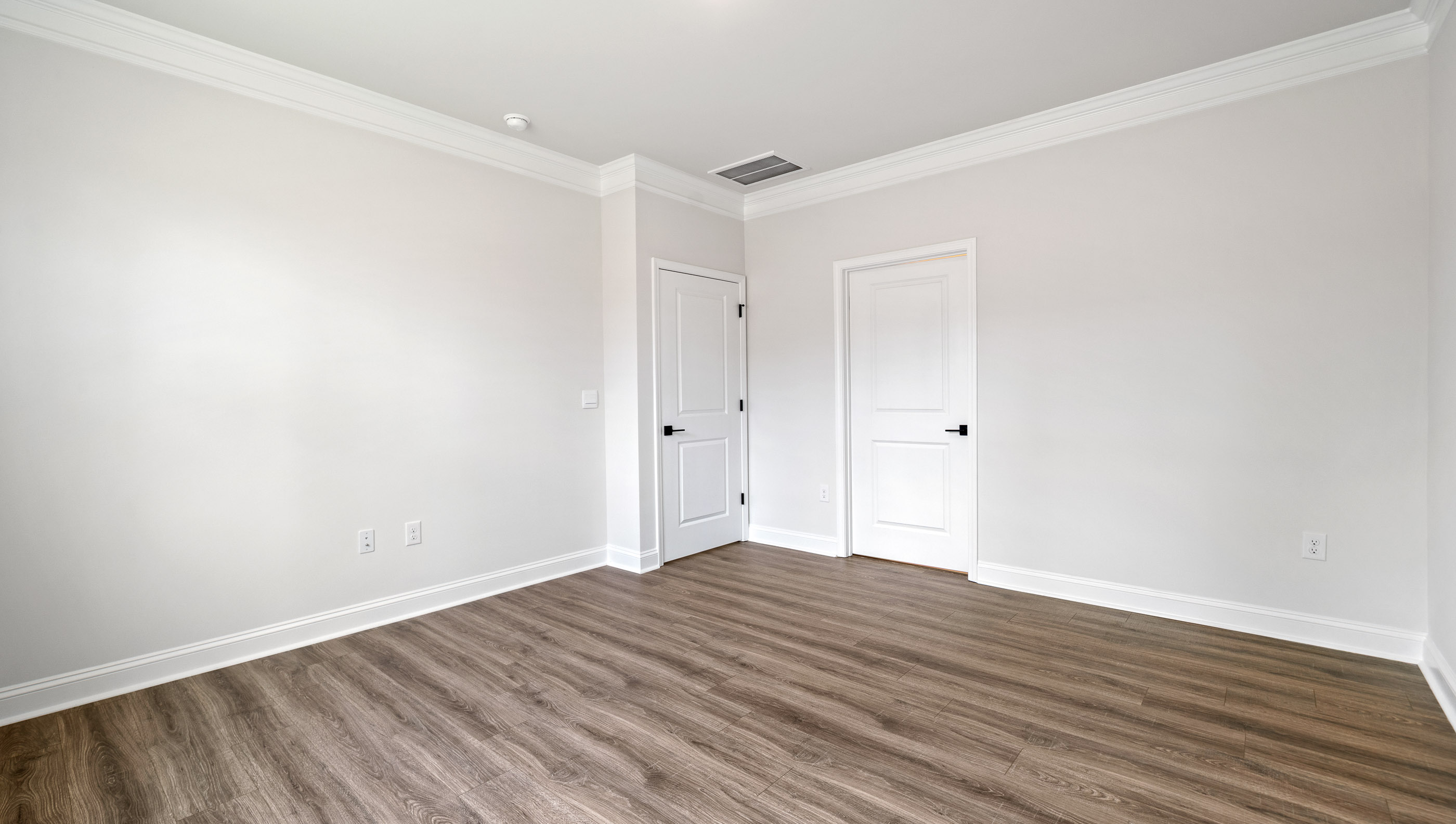 Bedroom with carpet and window.