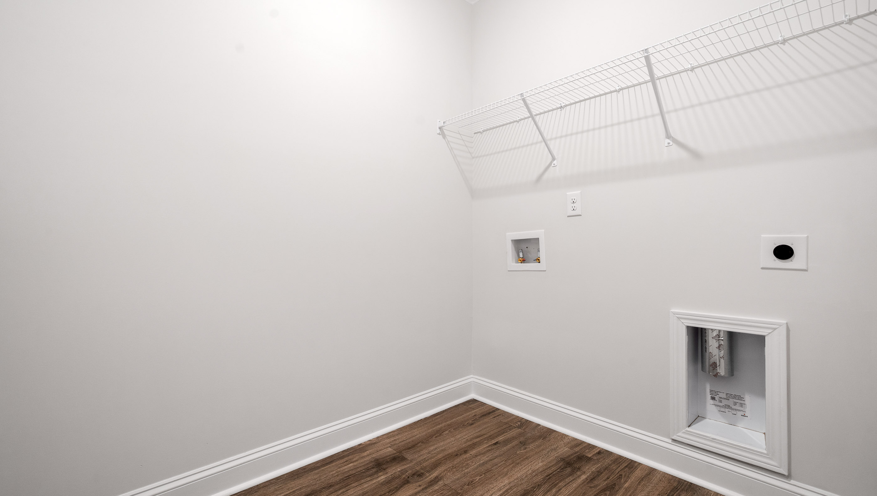 Laundry room with racks.