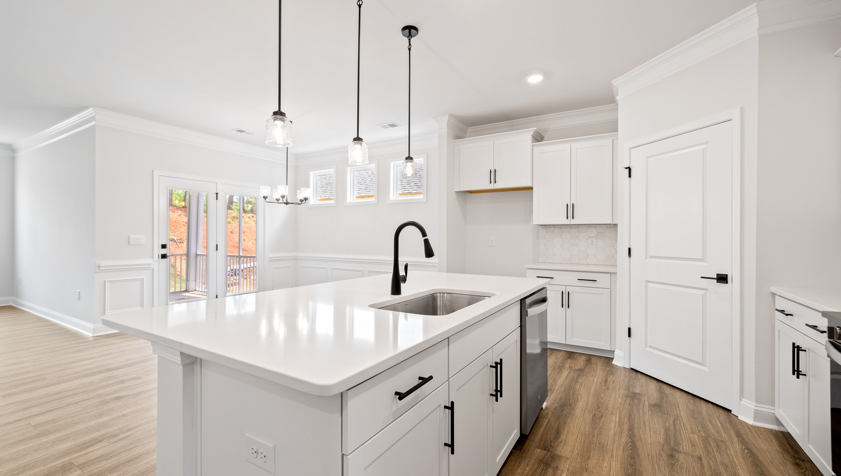 Kitchen and island with granite counter tops.