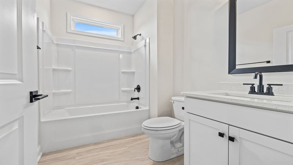 Bathroom with vanity and tub.