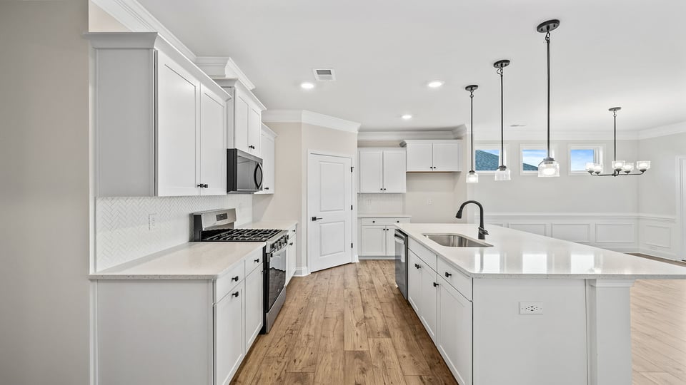 Kitchen and island with granite countertops.