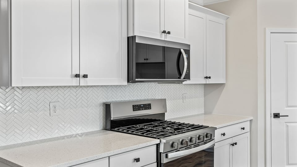 Kitchen with granite countertops and stainless steel appliances.