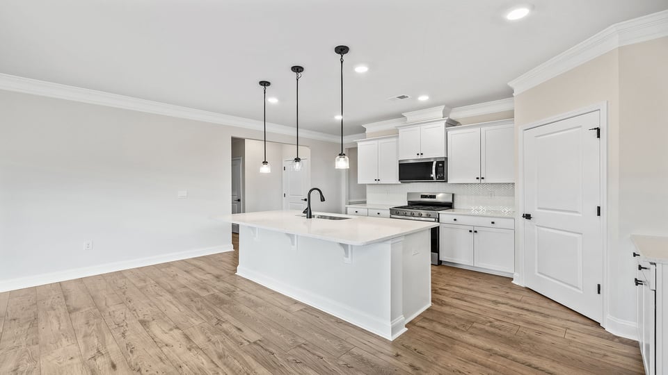 Kitchen and island with granite countertops.