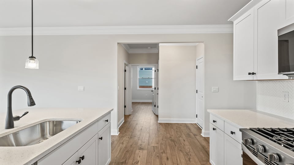 Kitchen and island with granite countertops.