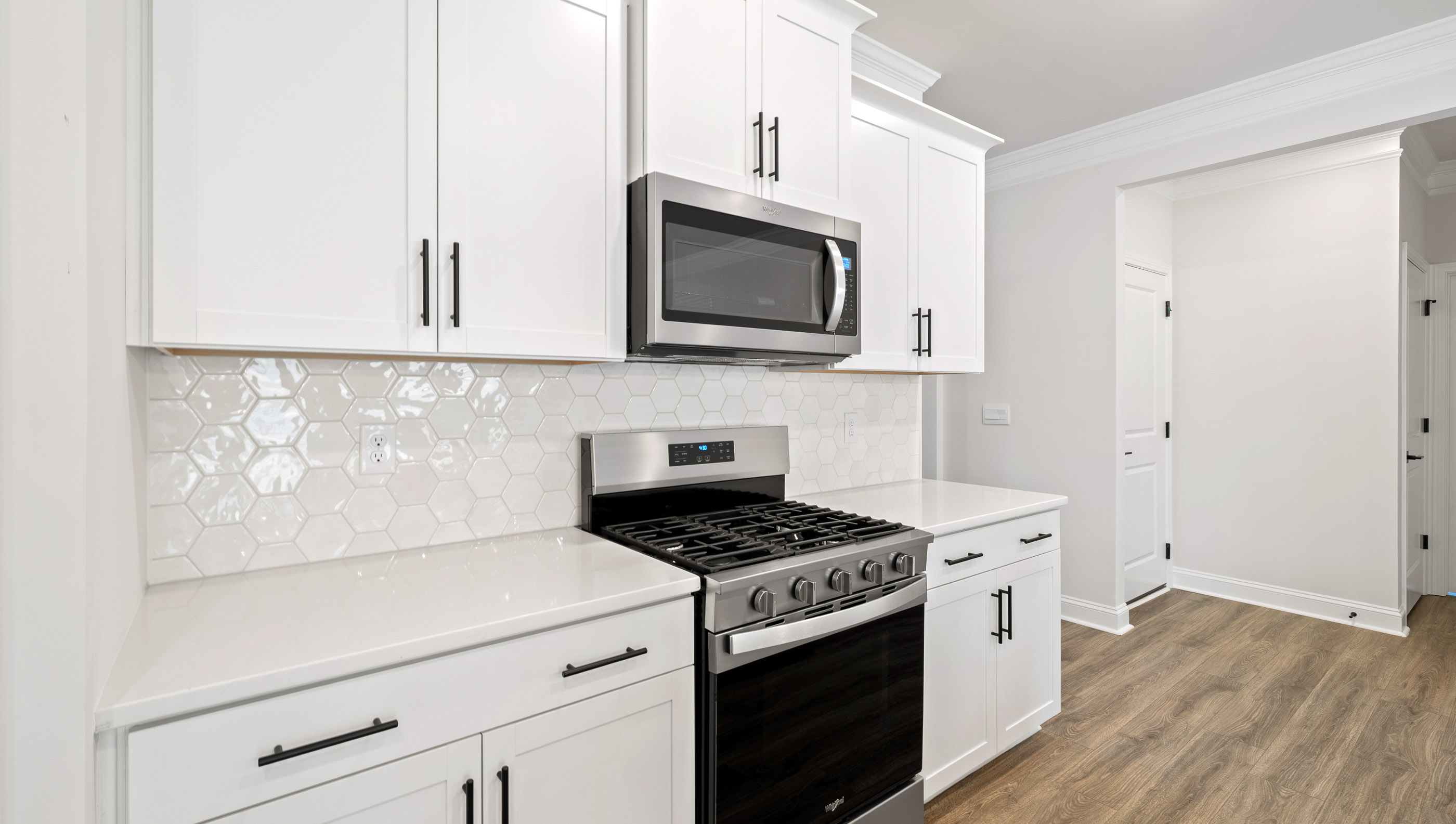Kitchen and island with granite counter tops.