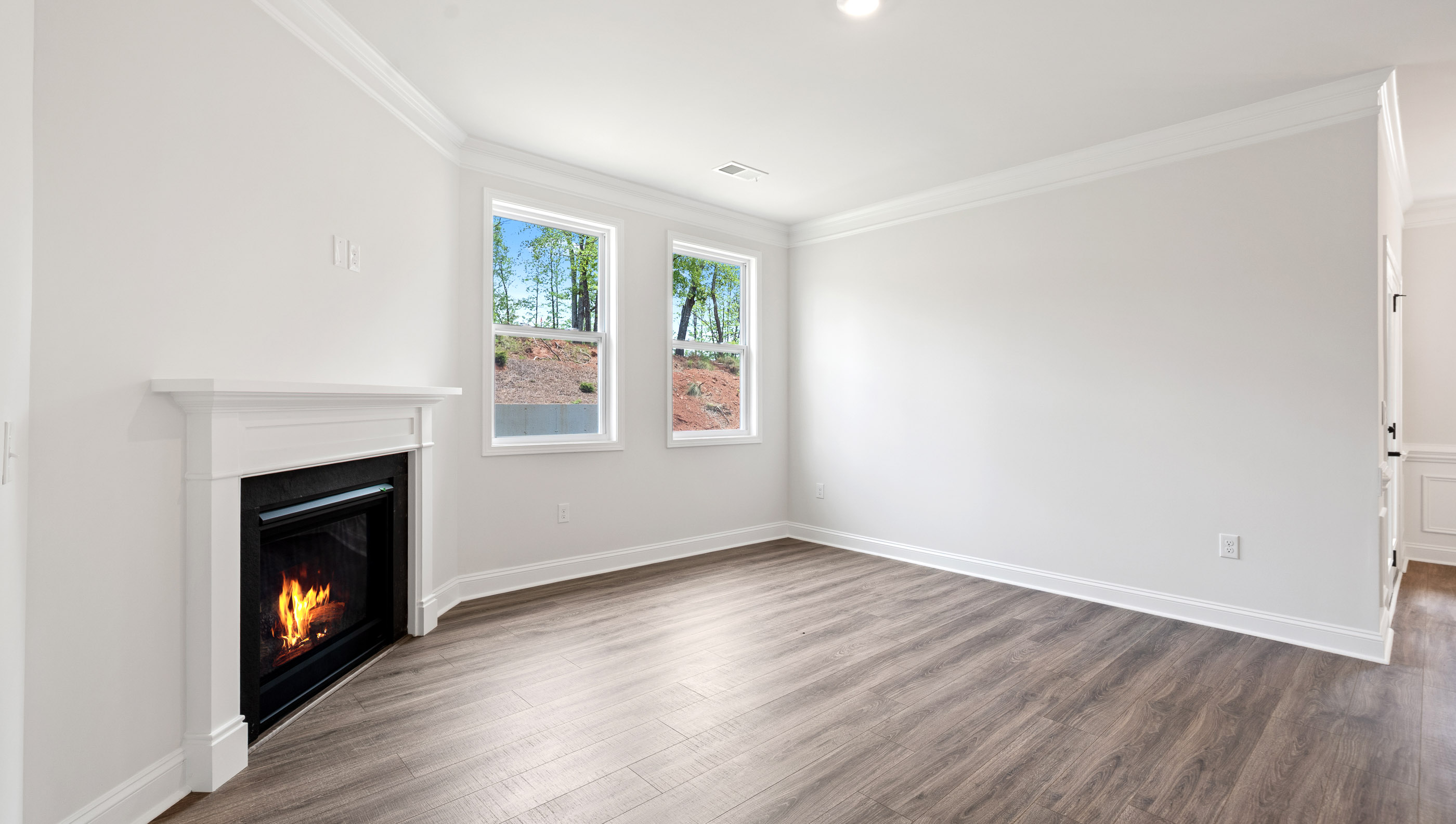 Family room with windows and fireplace.