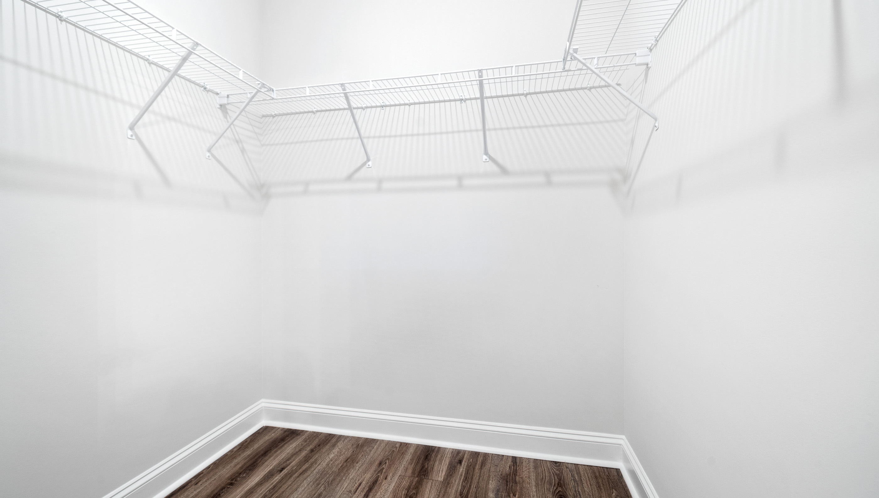 Closet with hanging storage racks.