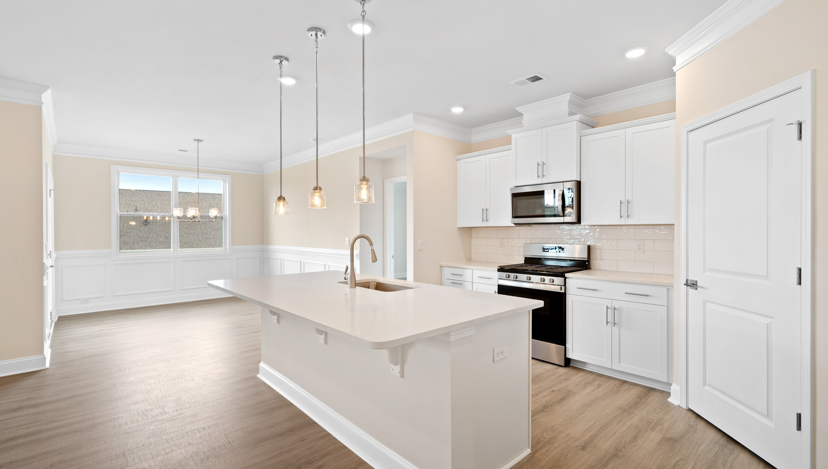 Kitchen and island with granite counter tops.