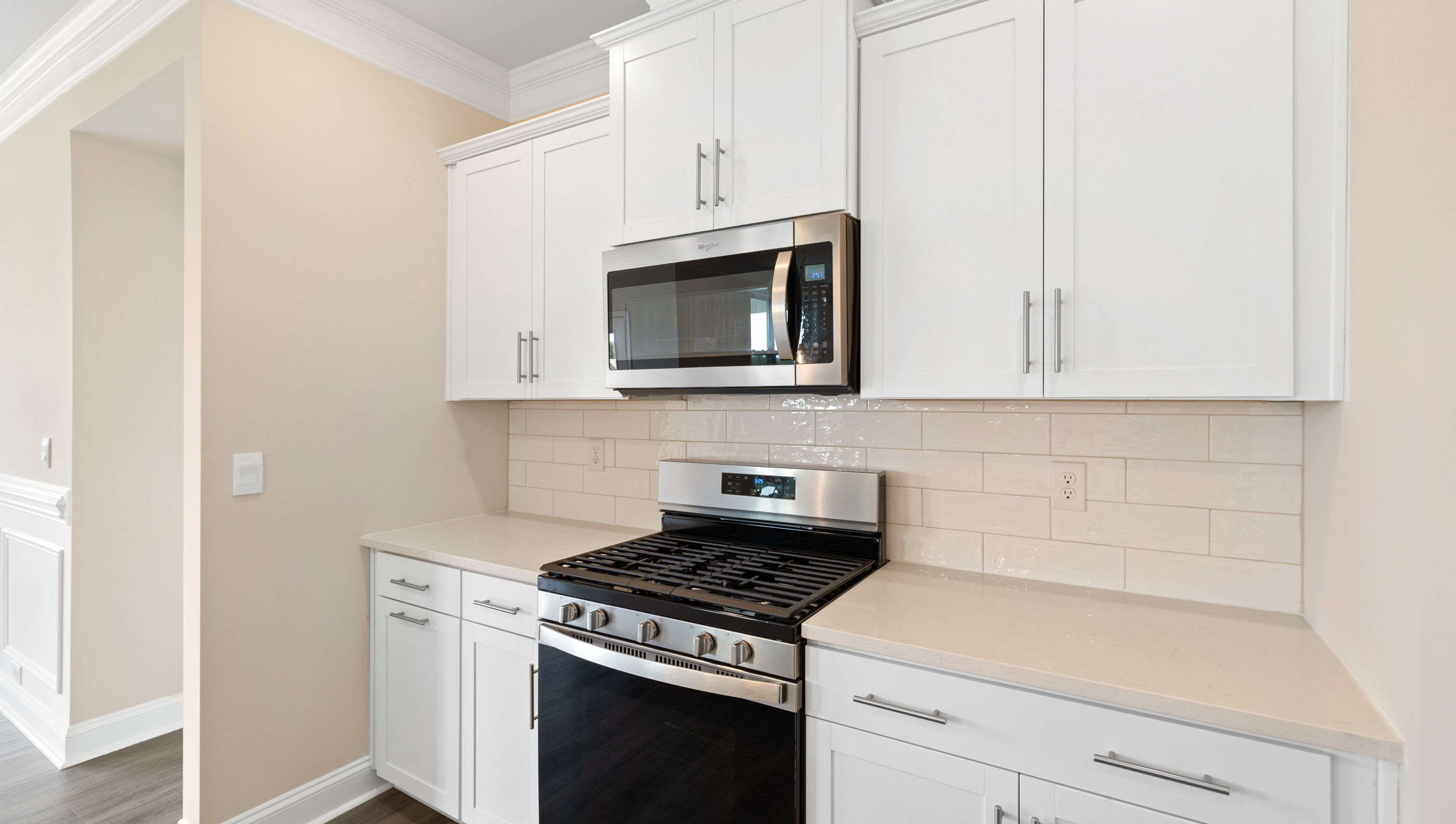Kitchen and island with granite counter tops.
