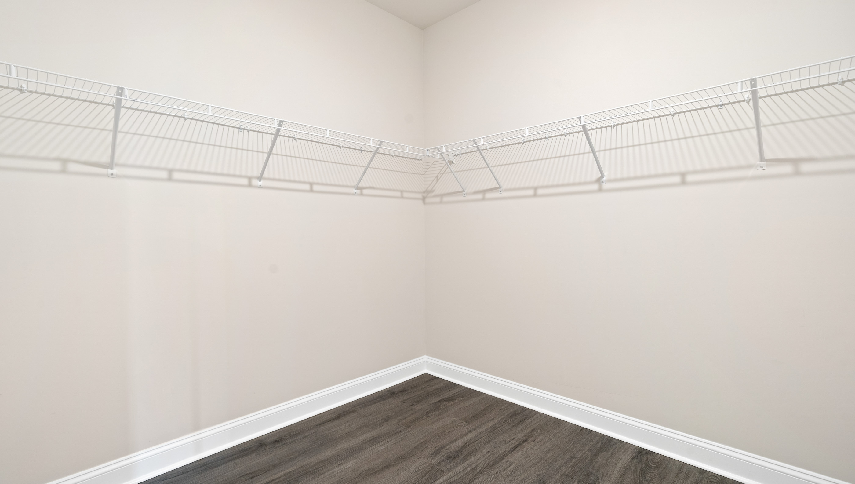 Closet with hanging storage racks.