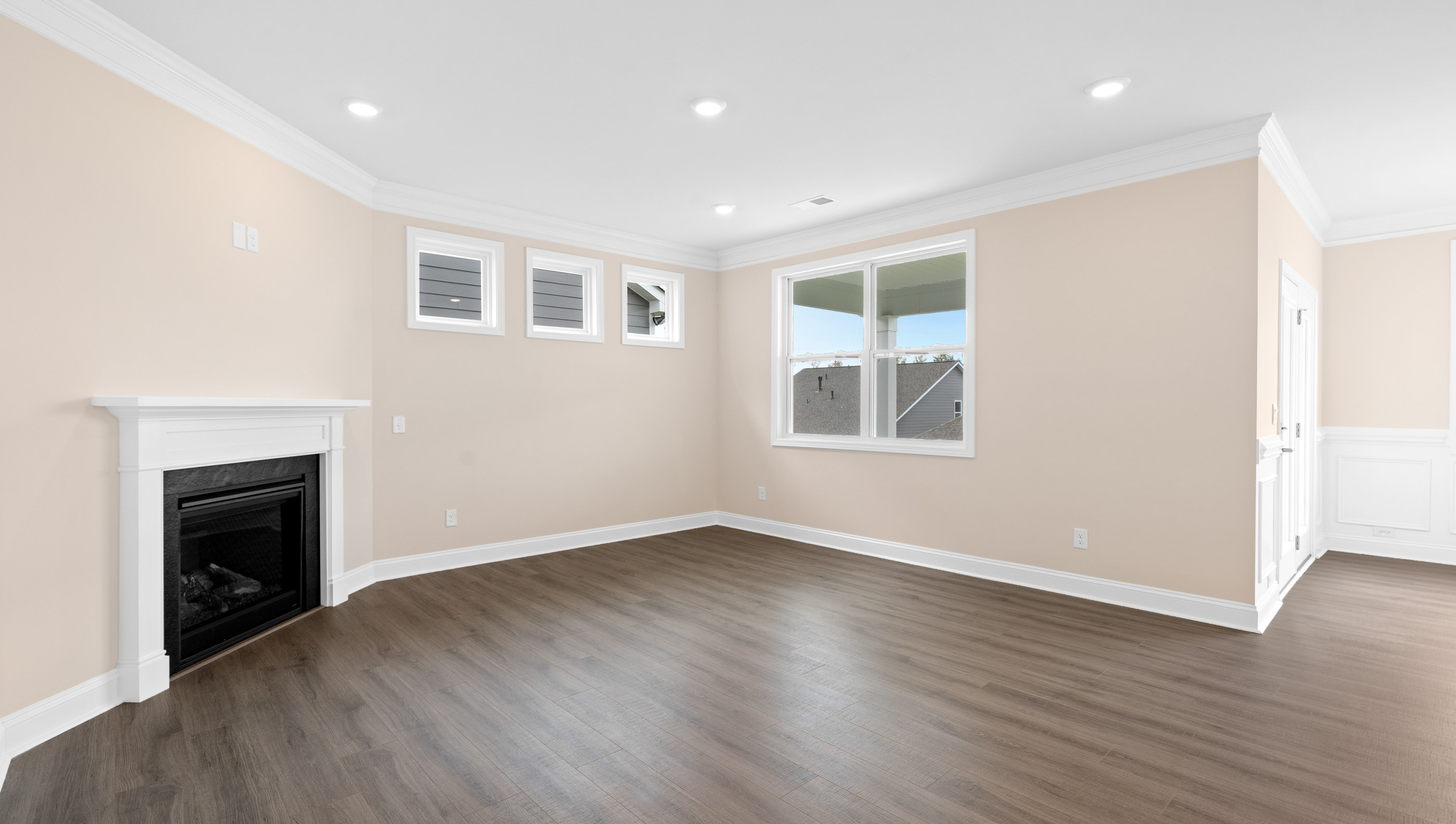Family room with windows and fireplace.