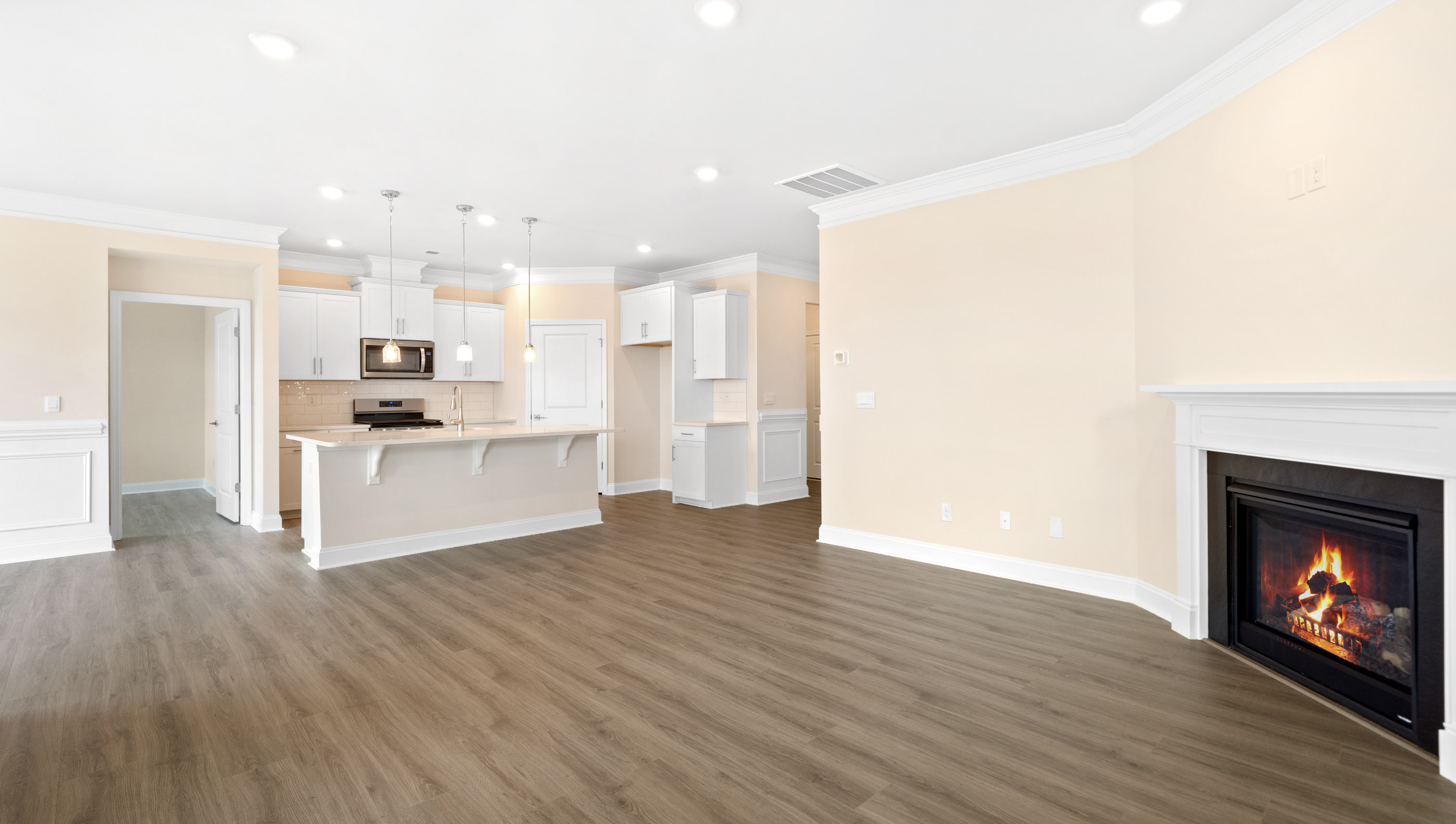 Family room with windows and fireplace.