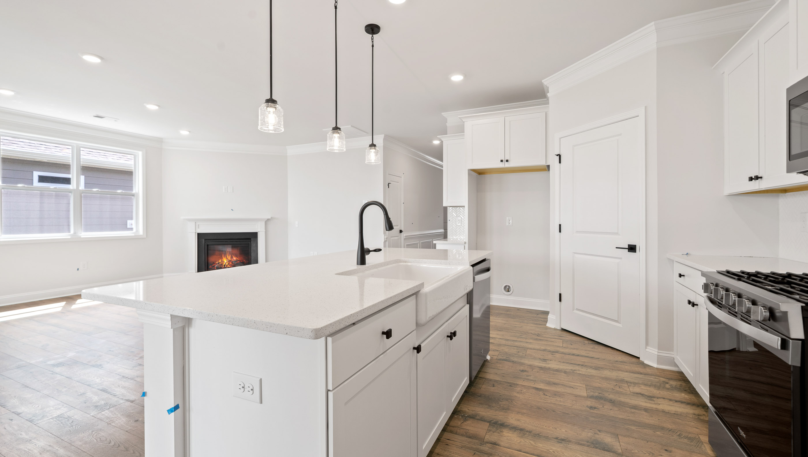 Kitchen and island with granite counter tops.