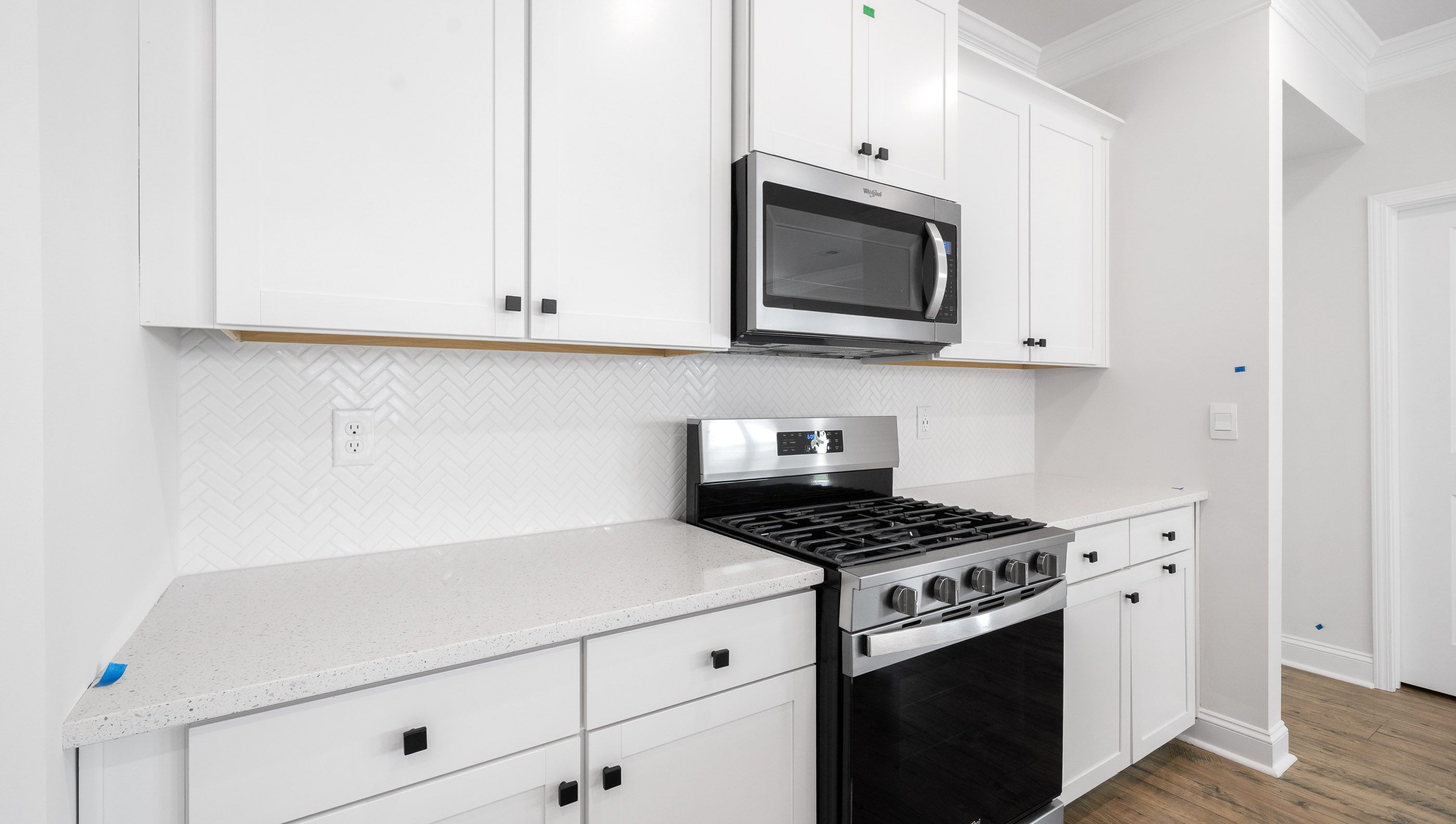 Kitchen with granite counter tops and stainless steel appliances.