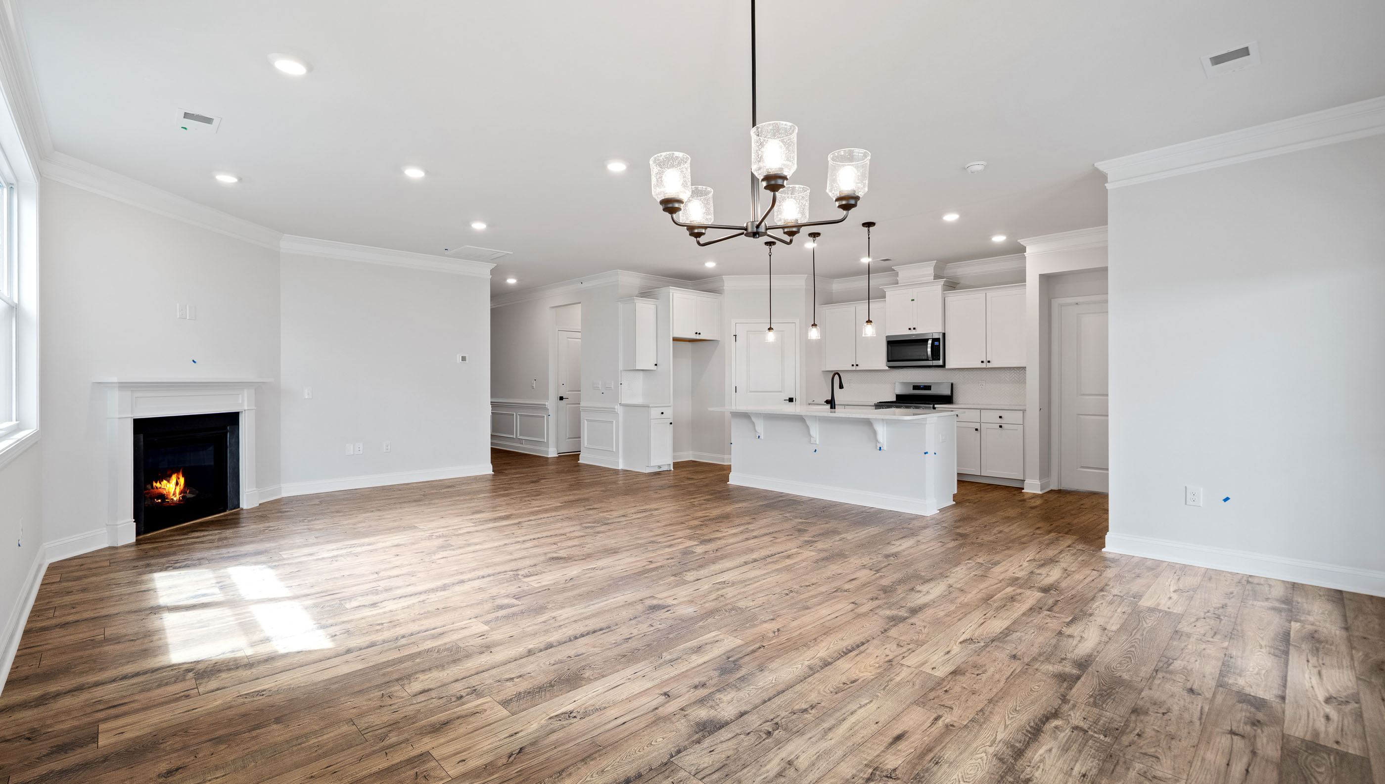 Great Room with fireplace and windows.