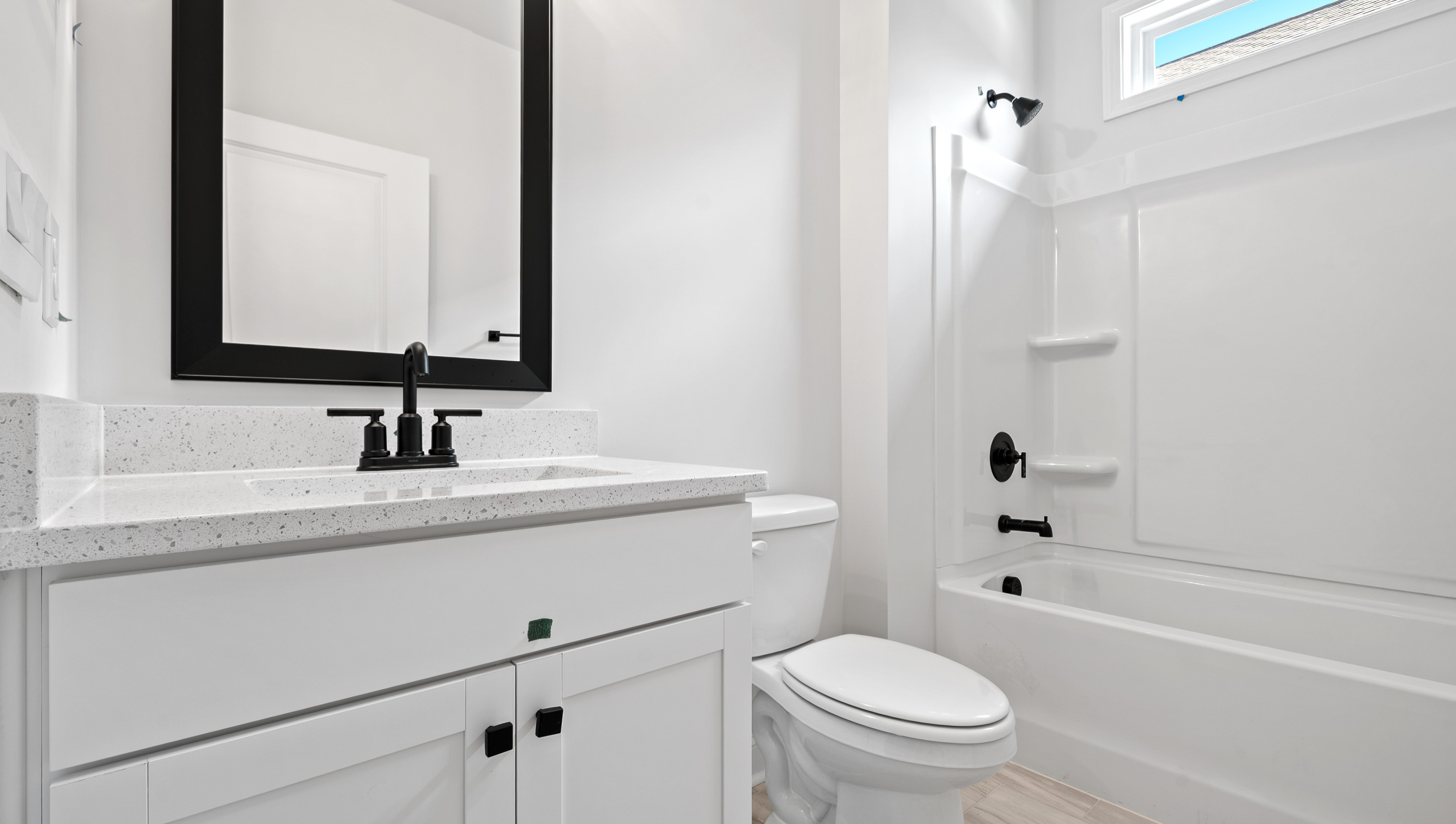 Bathroom with vanity and tub.