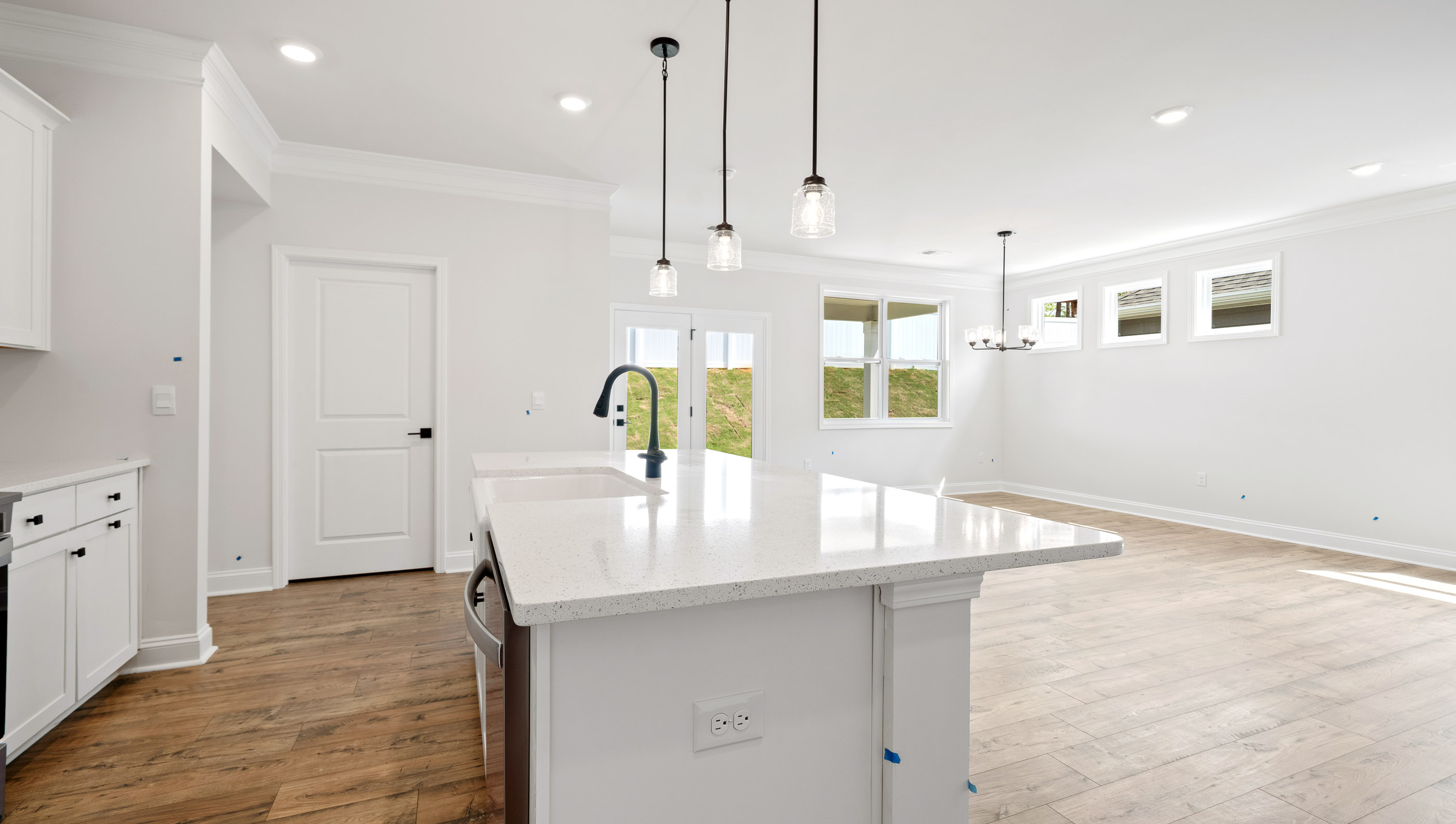 Kitchen and island with granite counter tops.