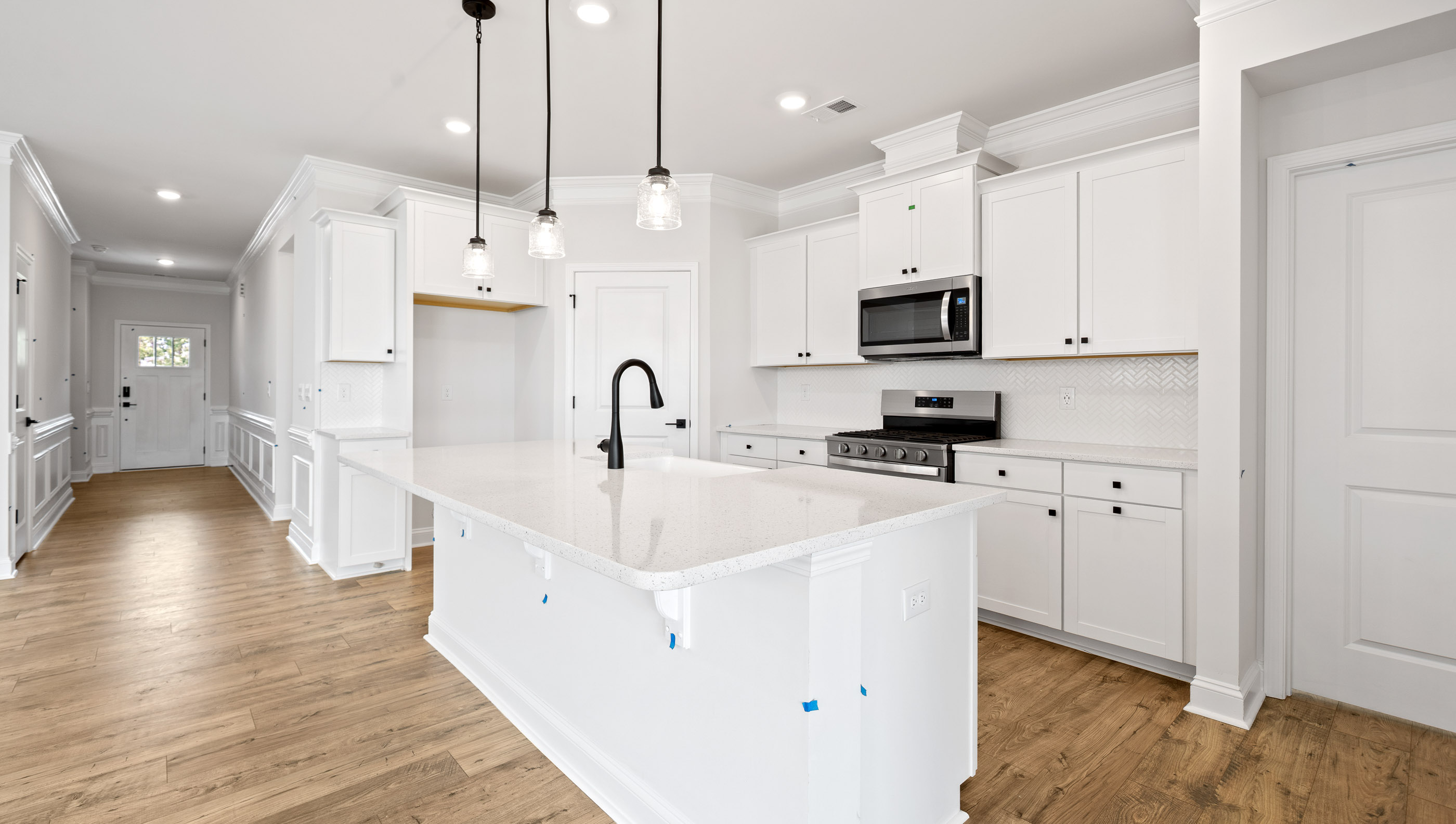 Kitchen and island with granite counter tops.