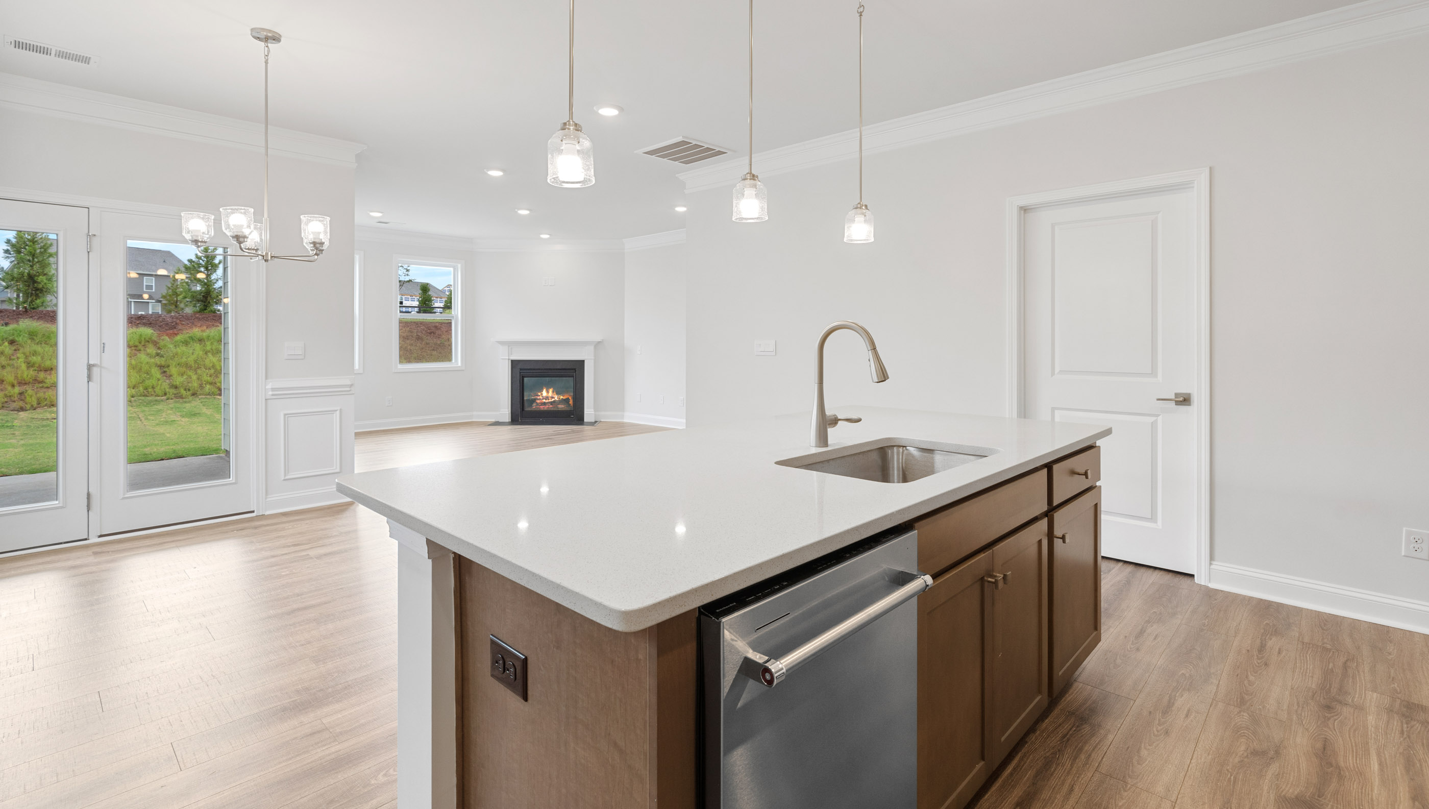Kitchen and island with granite counter tops.
