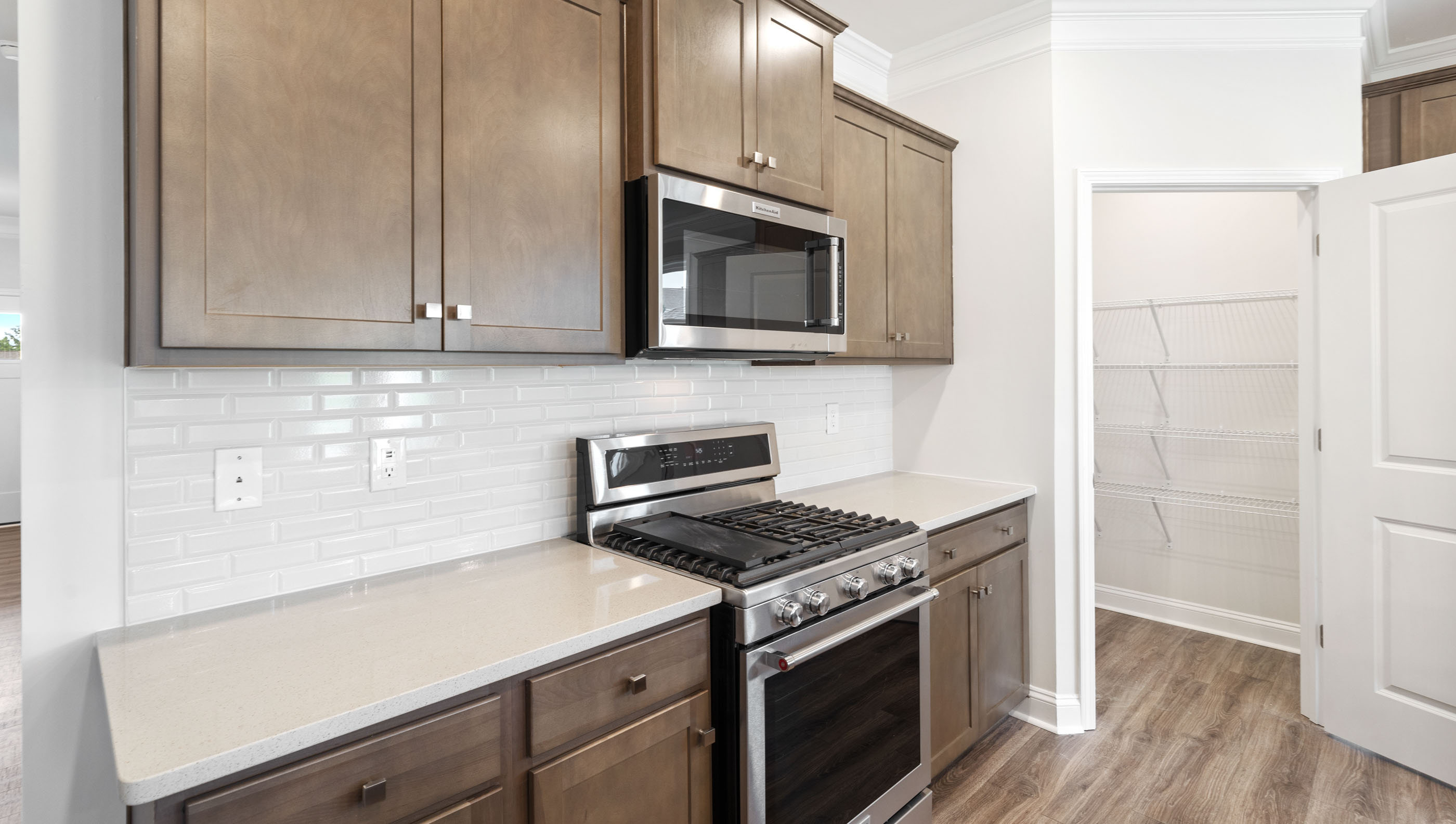 Kitchen and island with granite counter tops.