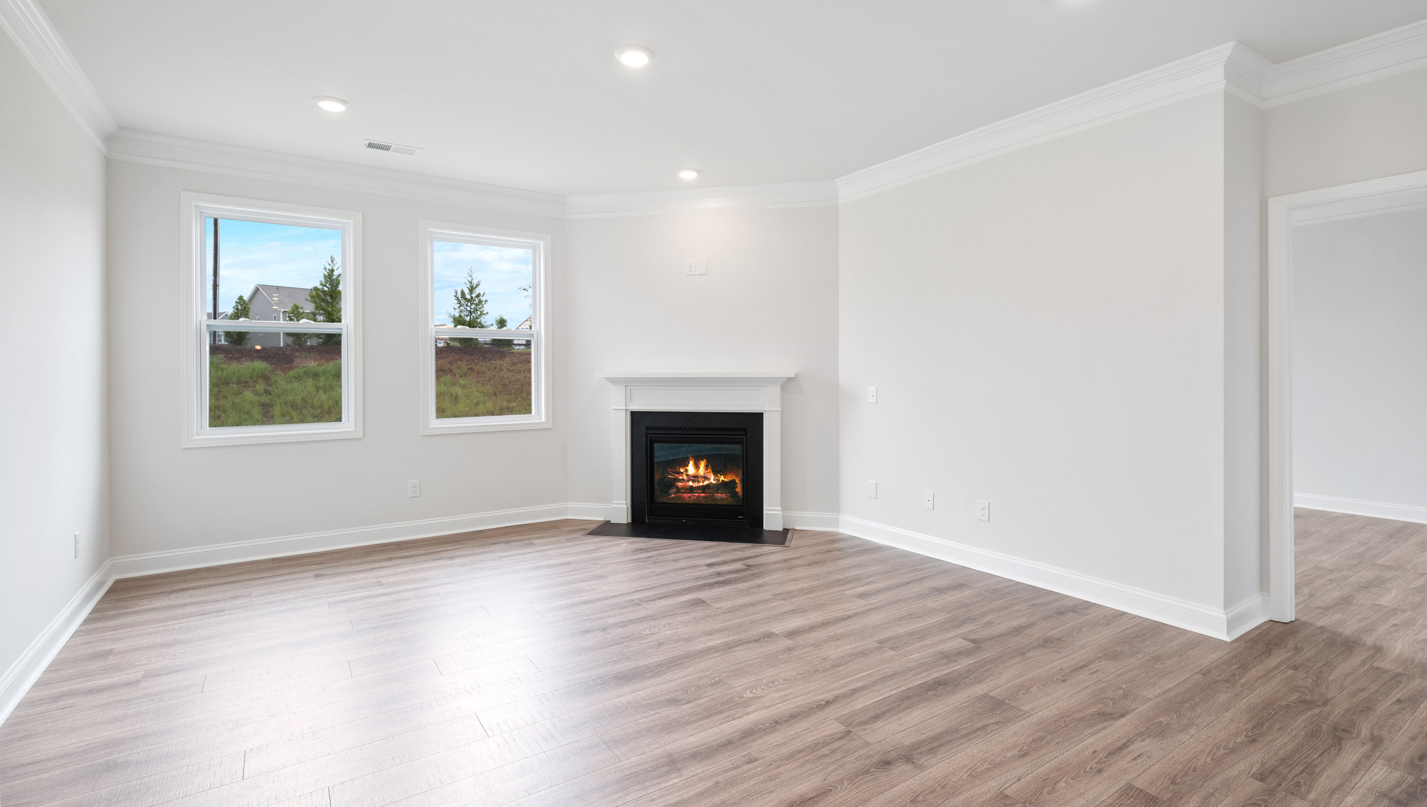 Family room with windows and fireplace