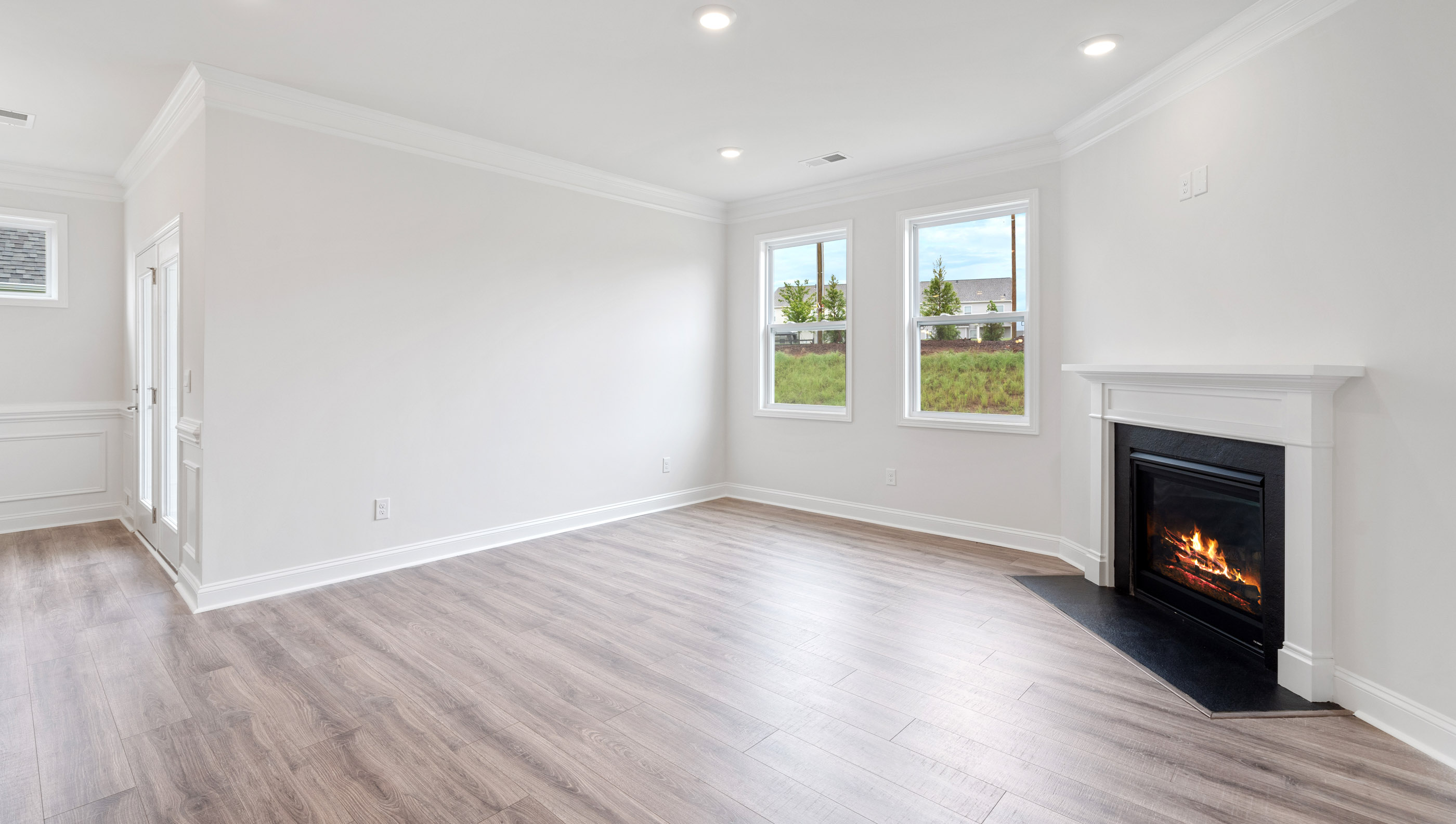 Family room with windows and fireplace