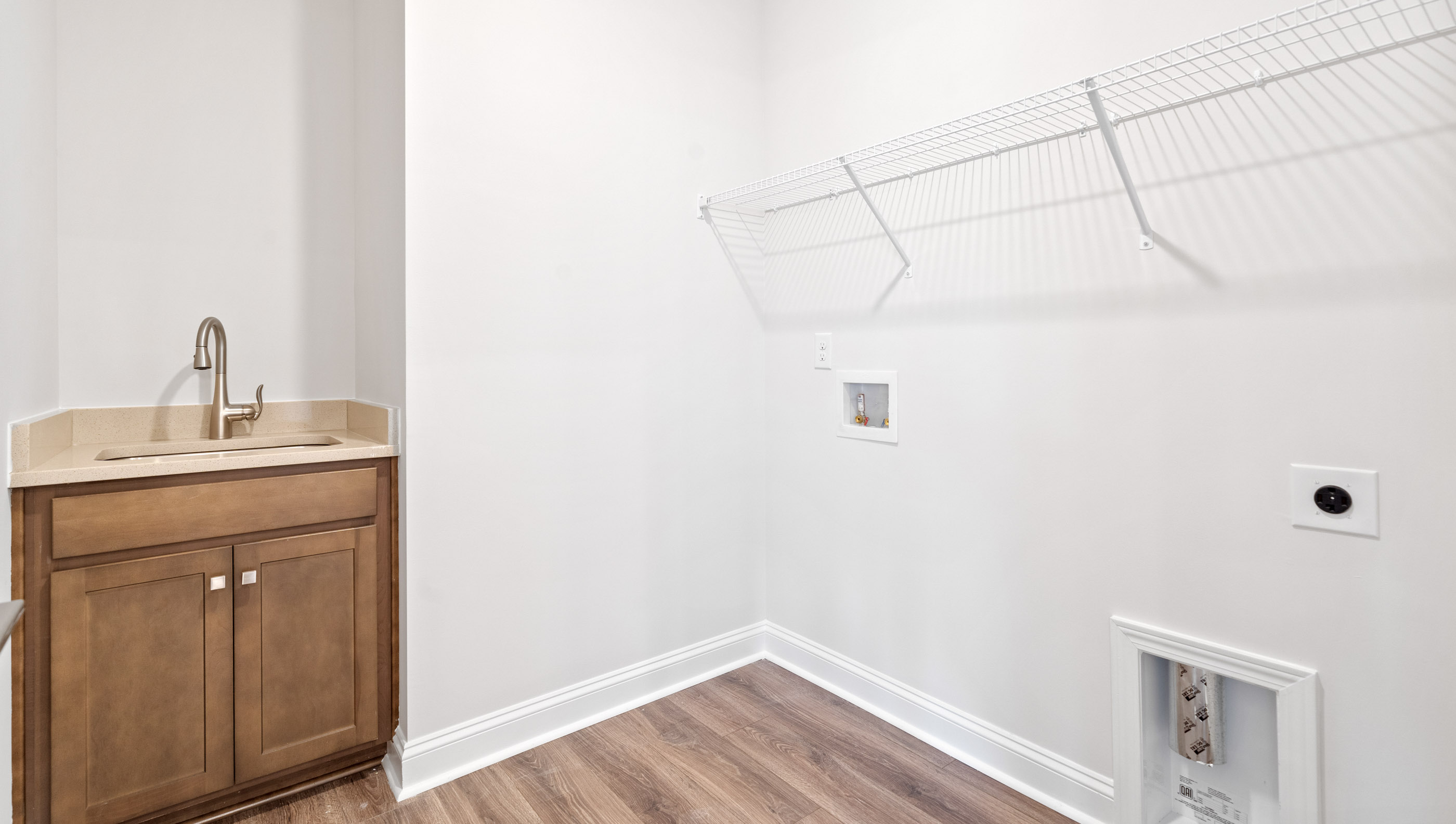 Laundry room with storage racks.