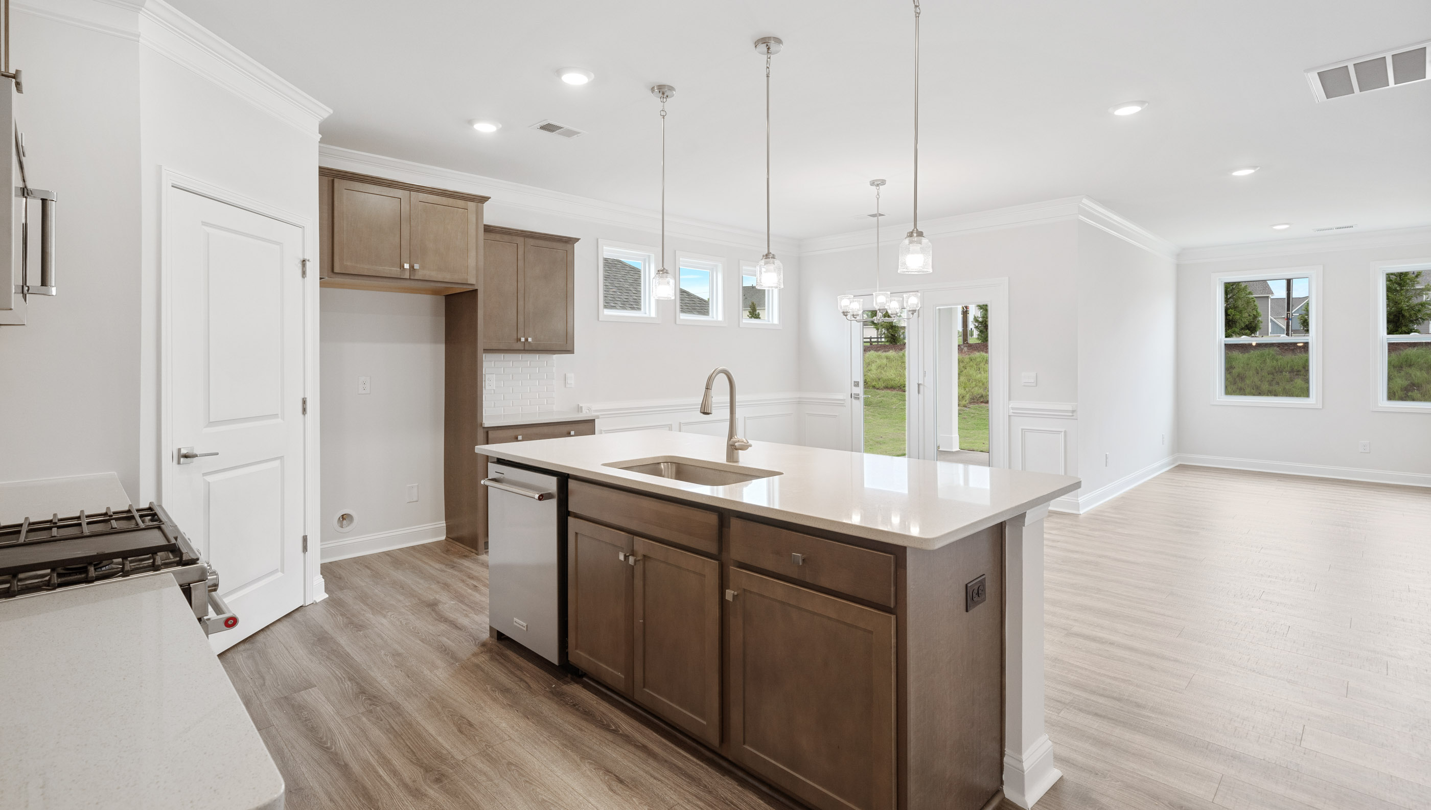 Kitchen and island with granite counter tops.