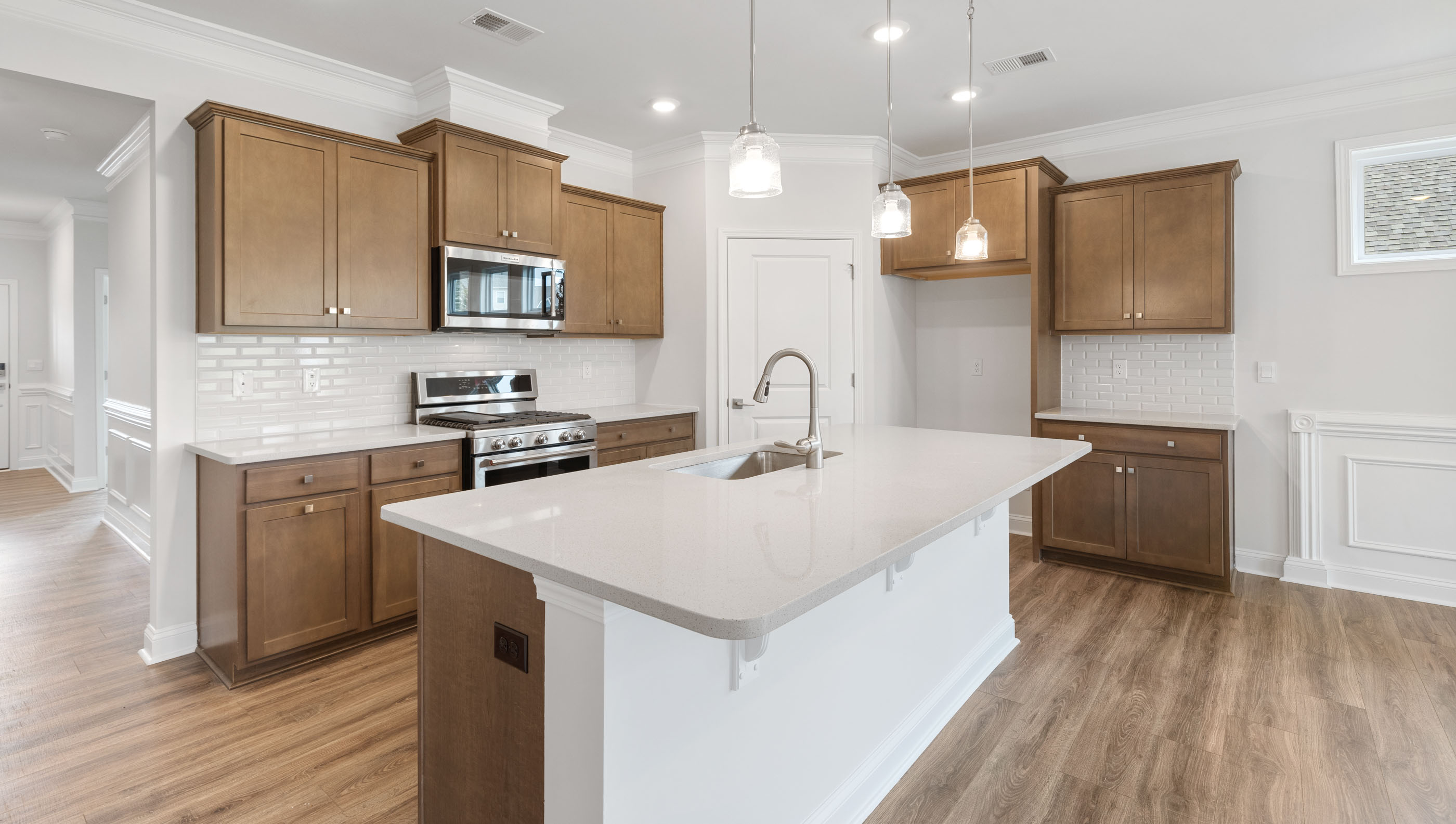Kitchen and island with granite counter tops.