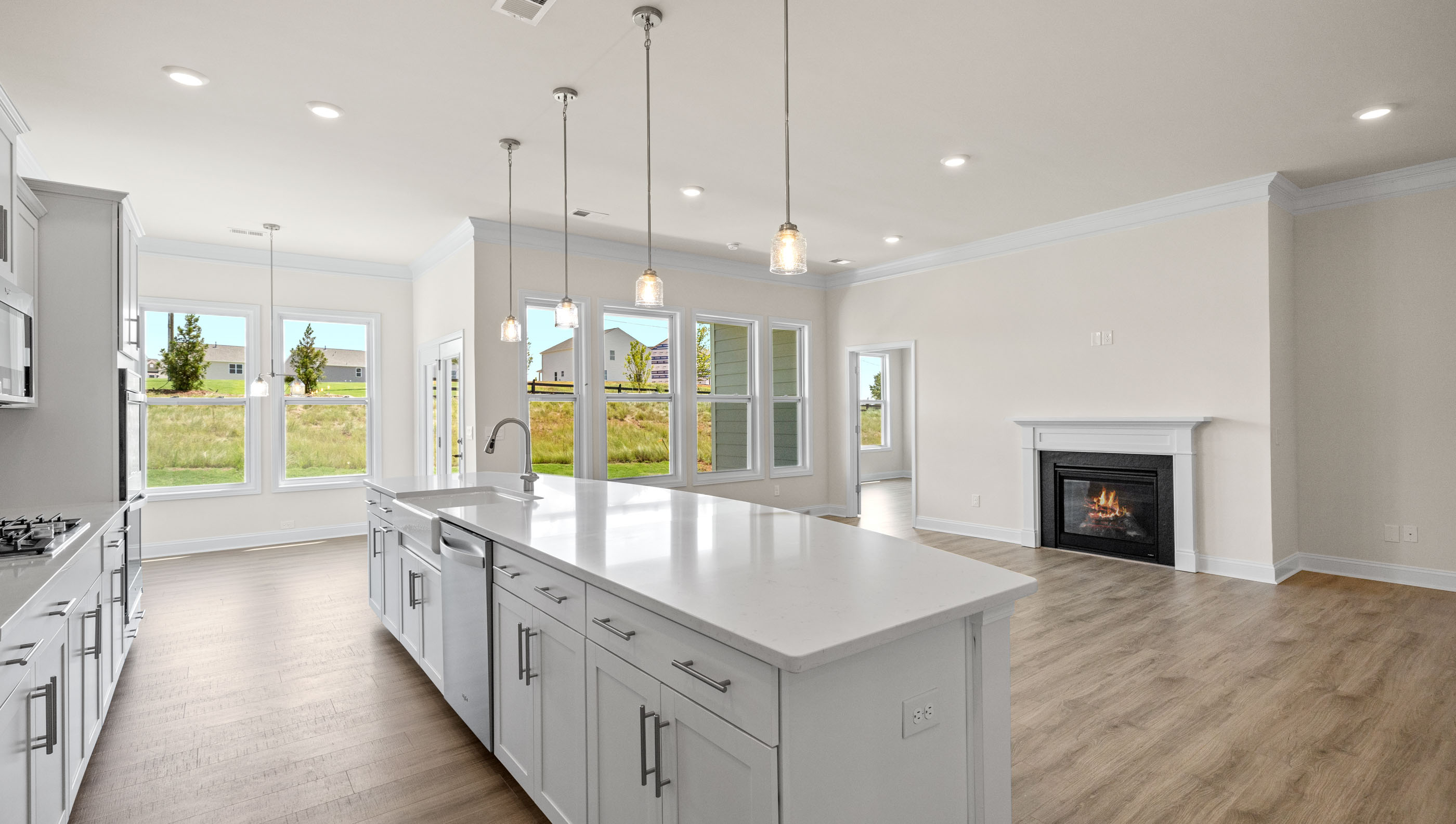Kitchen and island with quartz countertops.