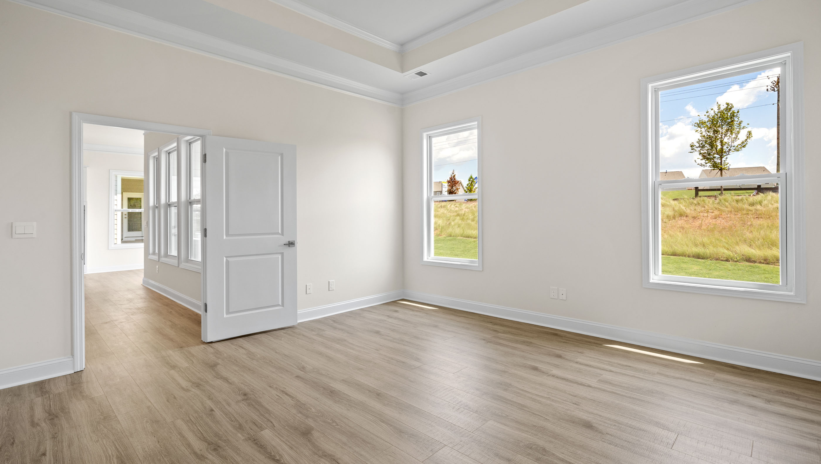 Primary bedroom with windows.