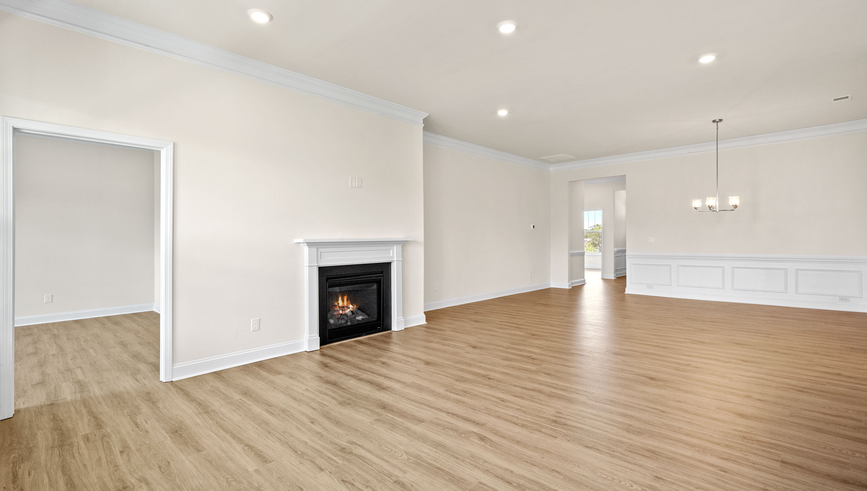Family room with fireplace facing dining room.