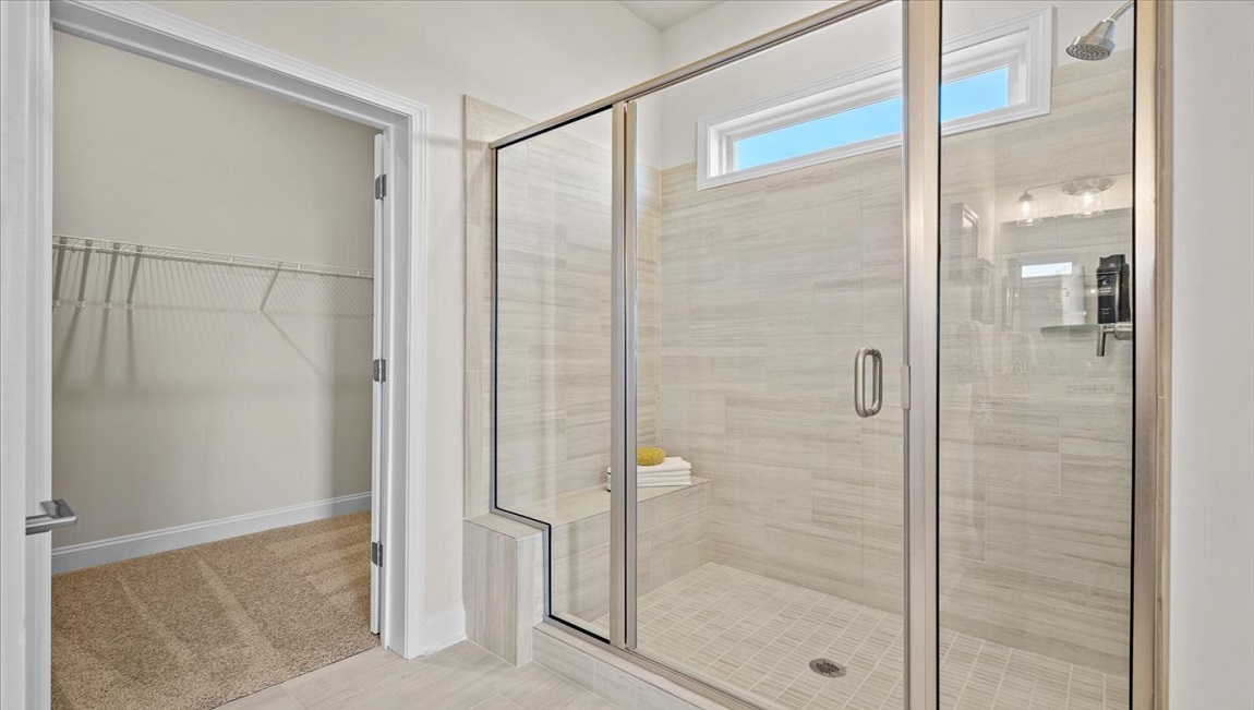 Bathroom with shower and closet.