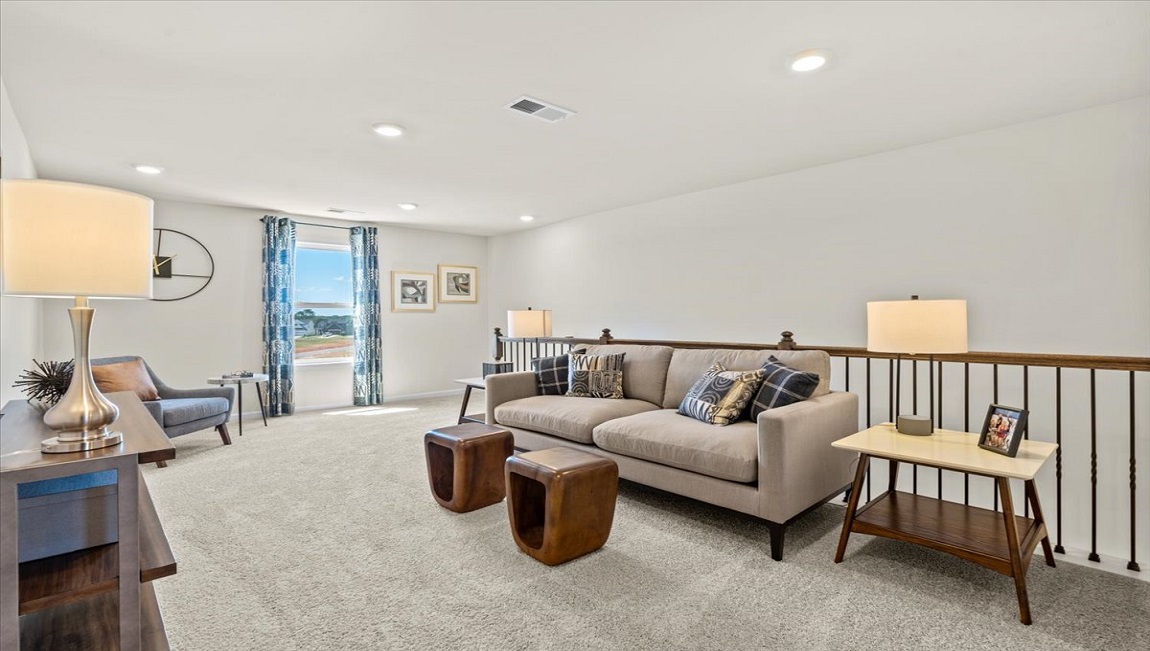 Bedroom with carpet and window.