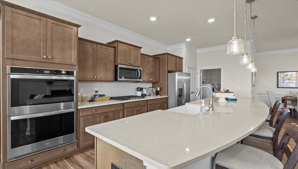 Kitchen and island with granite counter tops.