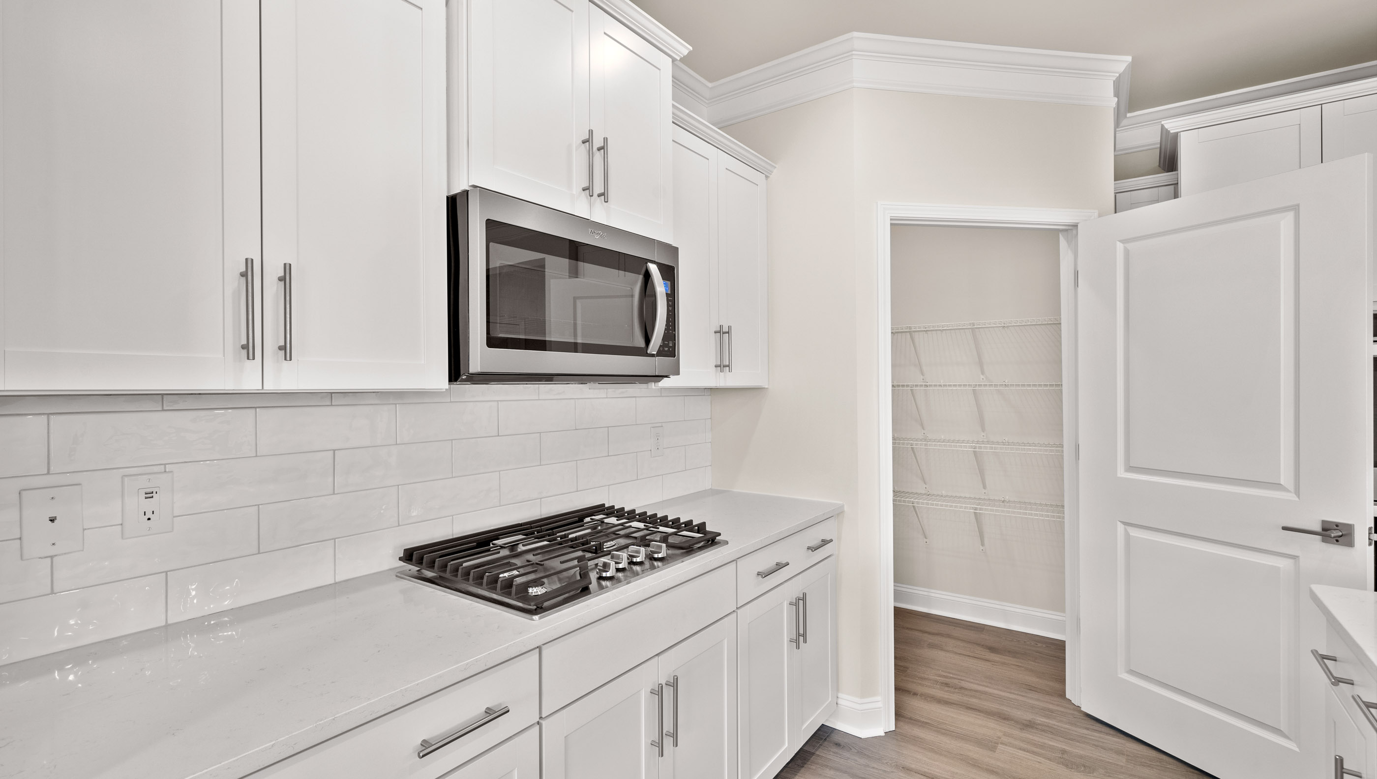 Kitchen and island with granite counter tops.