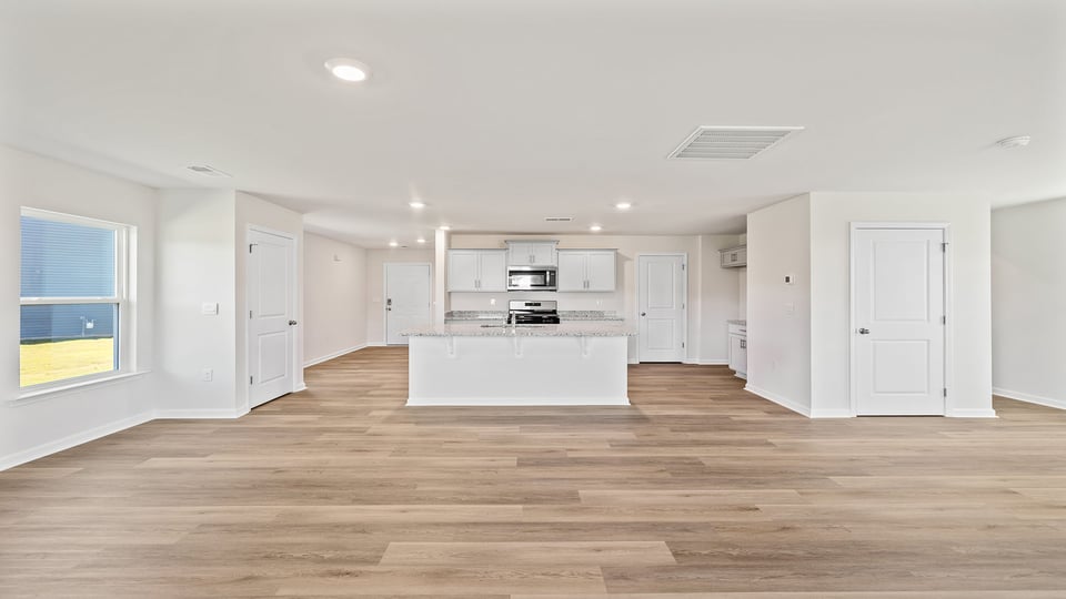 Kitchen and island with granite counter tops.