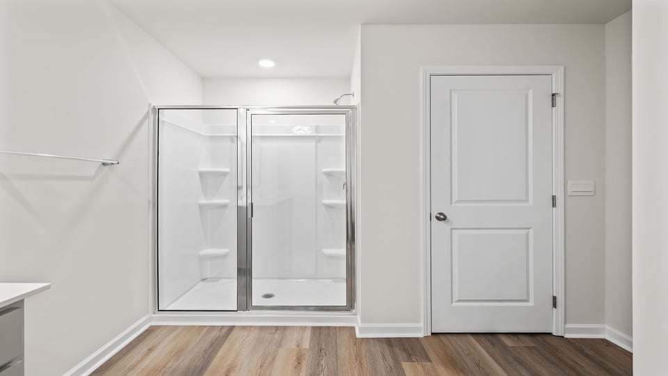 Bathroom with walk in shower.