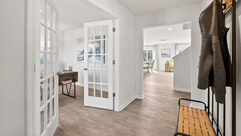 Hallway into home with flex room.