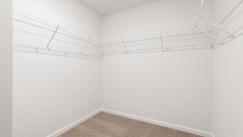 Closet with hanging storage racks.