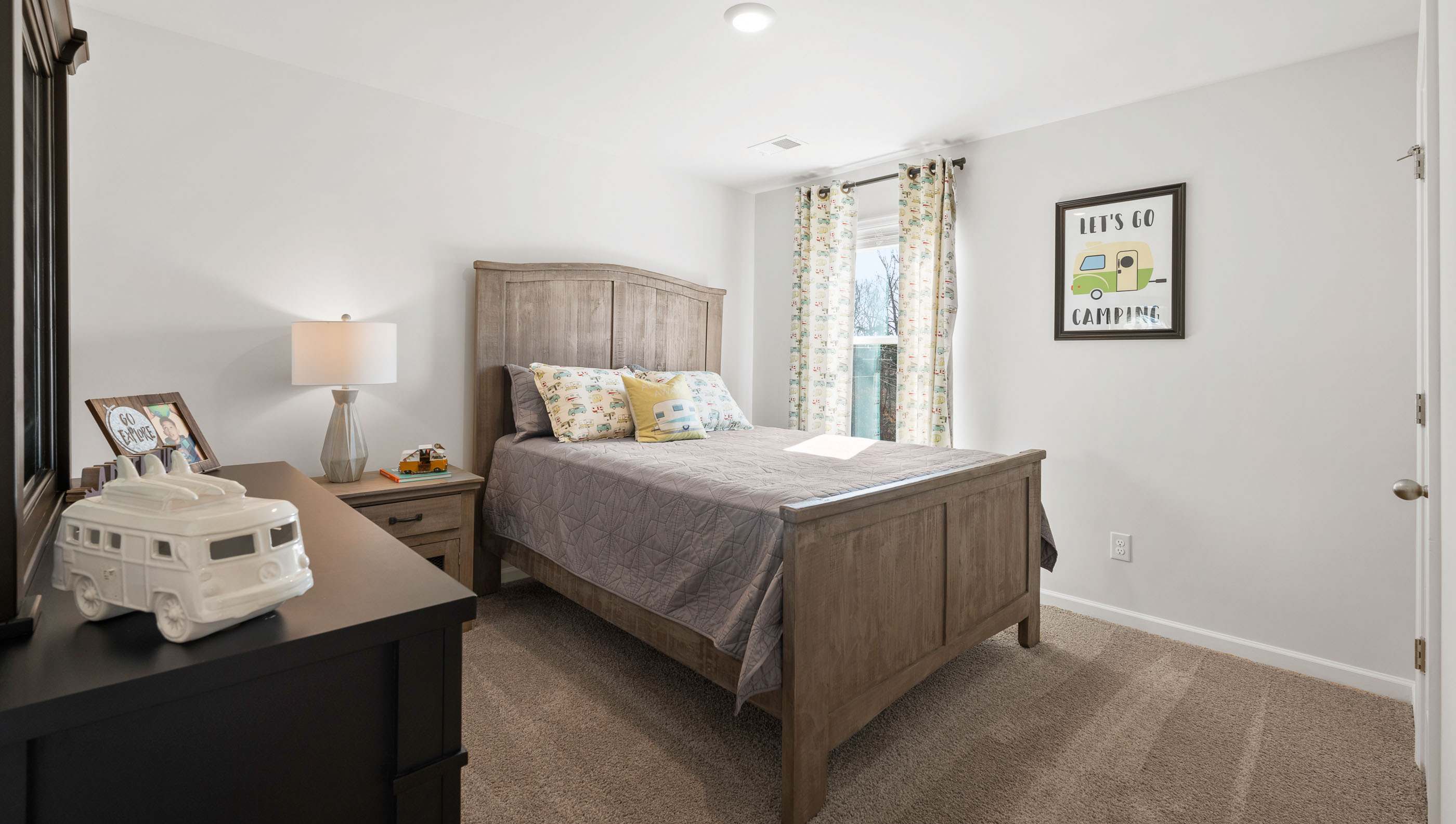 Bedroom with carpet and window.