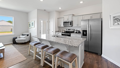 Kitchen and island with granite counter tops.