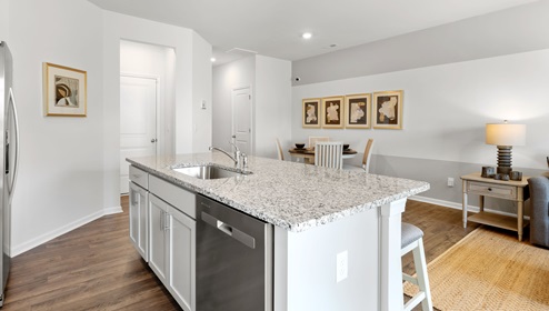 Kitchen and island with granite counter tops.