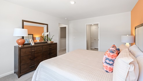 Bedroom with carpet and window.