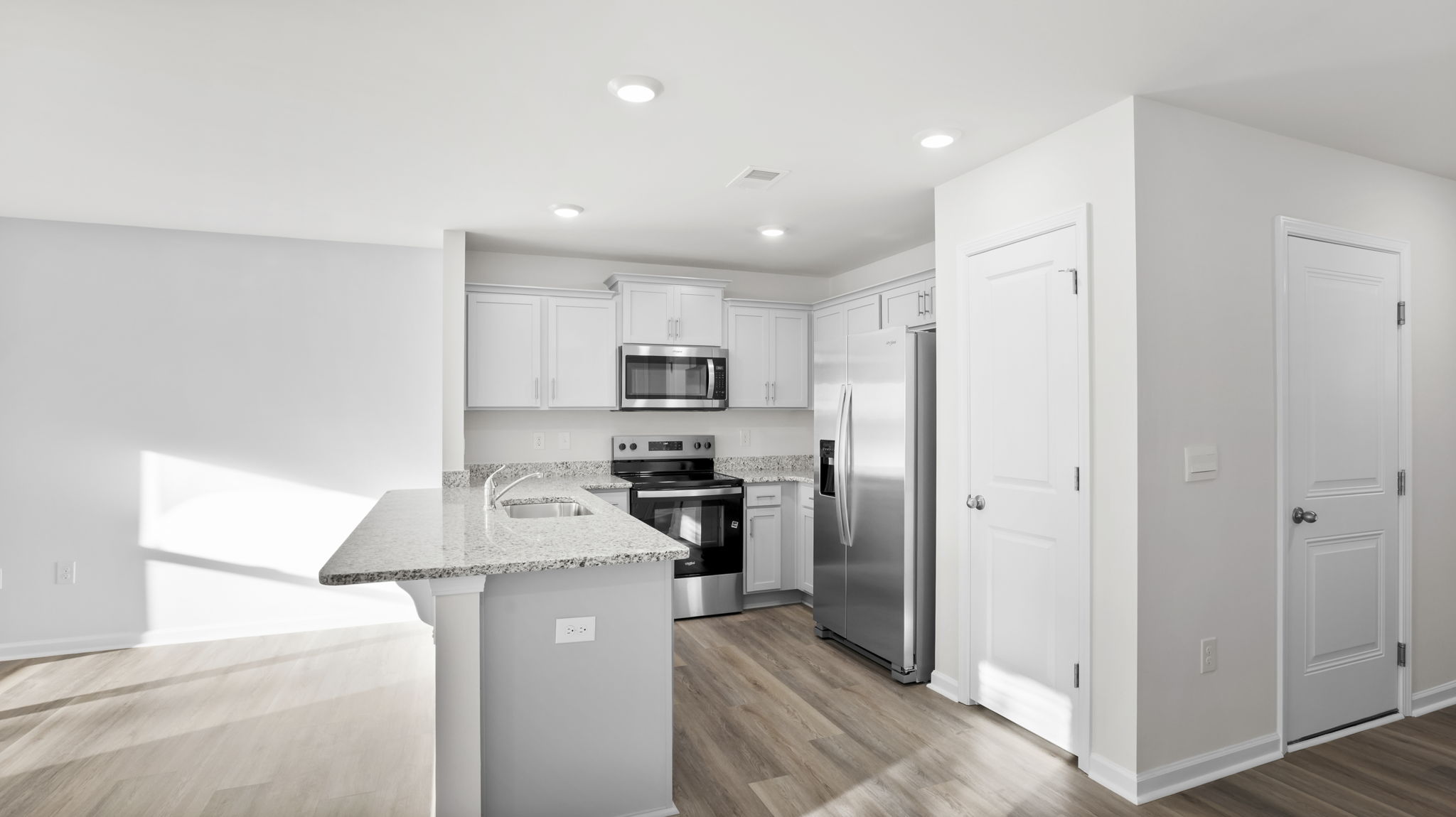 Kitchen with quartz countertops.