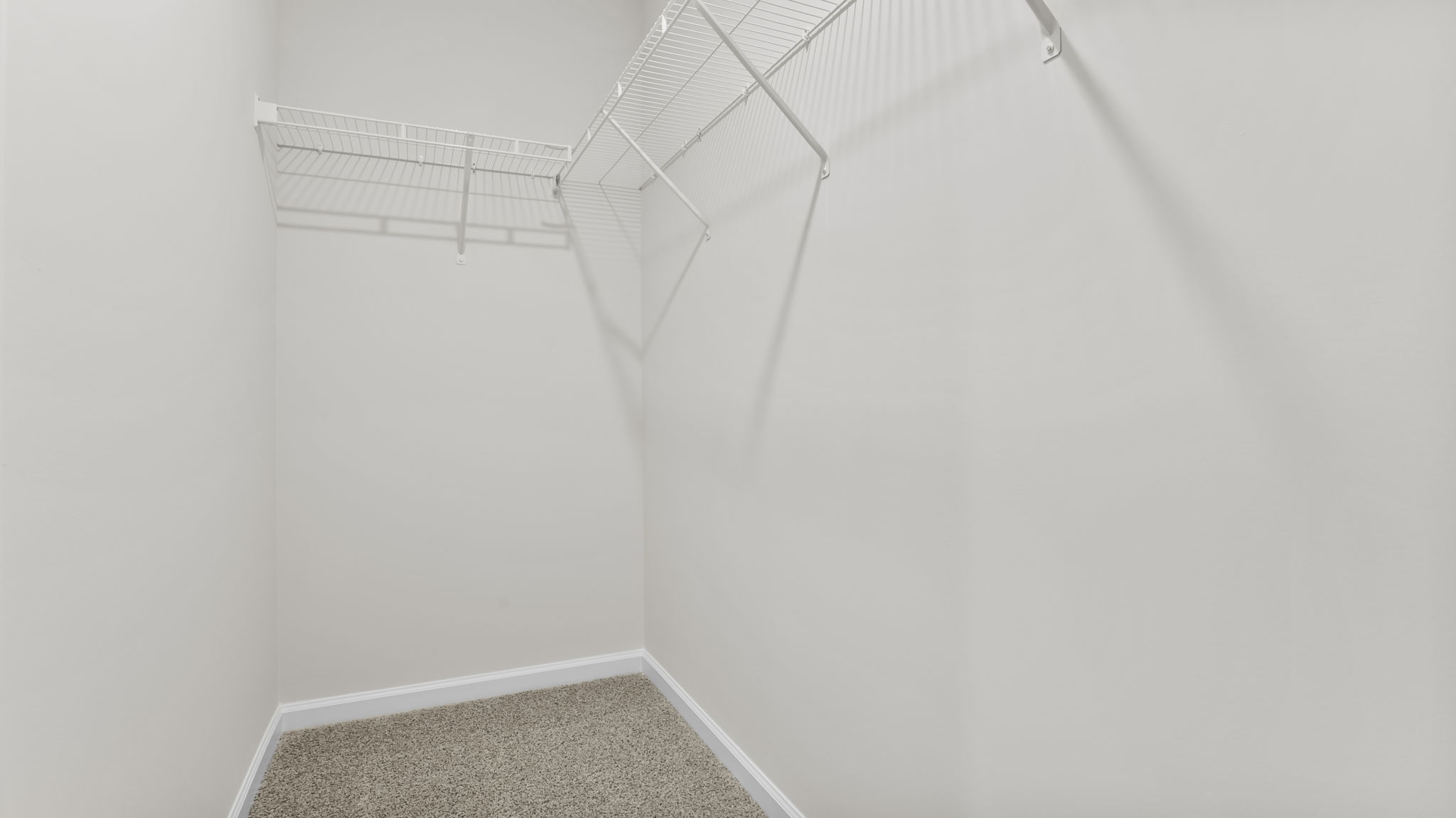 Primary bedroom walk-in closet.